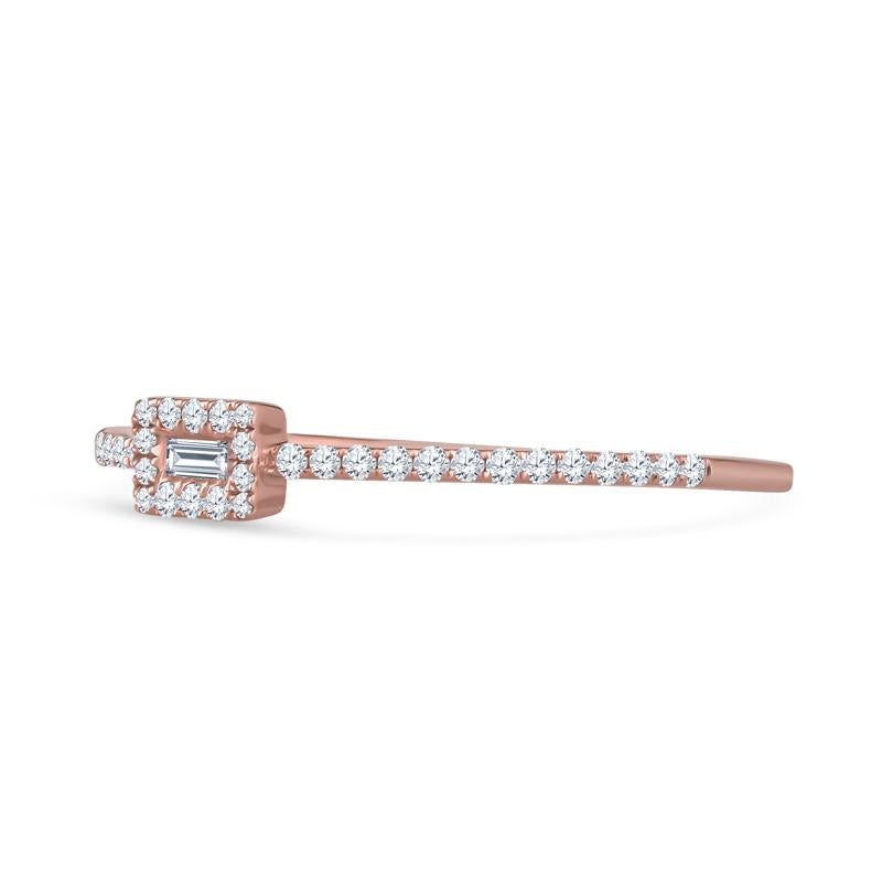 This dainty and fun ring features a small baguette diamond accented by a halo of round diamonds and diamonds on the band. This is a great stacking ring! It is set in 18 karat rose gold and is a size 6.5 but can be resized upon request.
Measurements: