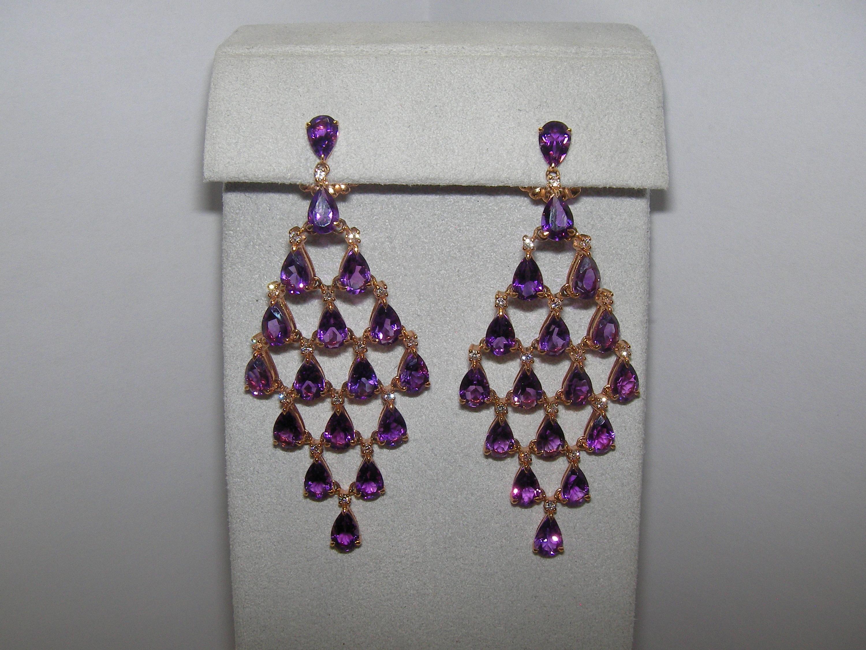 A dazzling pair of 18 Karat Rose Gold Dangle Earrings encrusted with Diamonds accenting each vivid Amethyst stone. 


34 Amethyst 12,92 Carat
32 Diamonds 0.44 Carat


Founded in 1974, Gianni Lazzaro is a family-owned jewelery company based out of