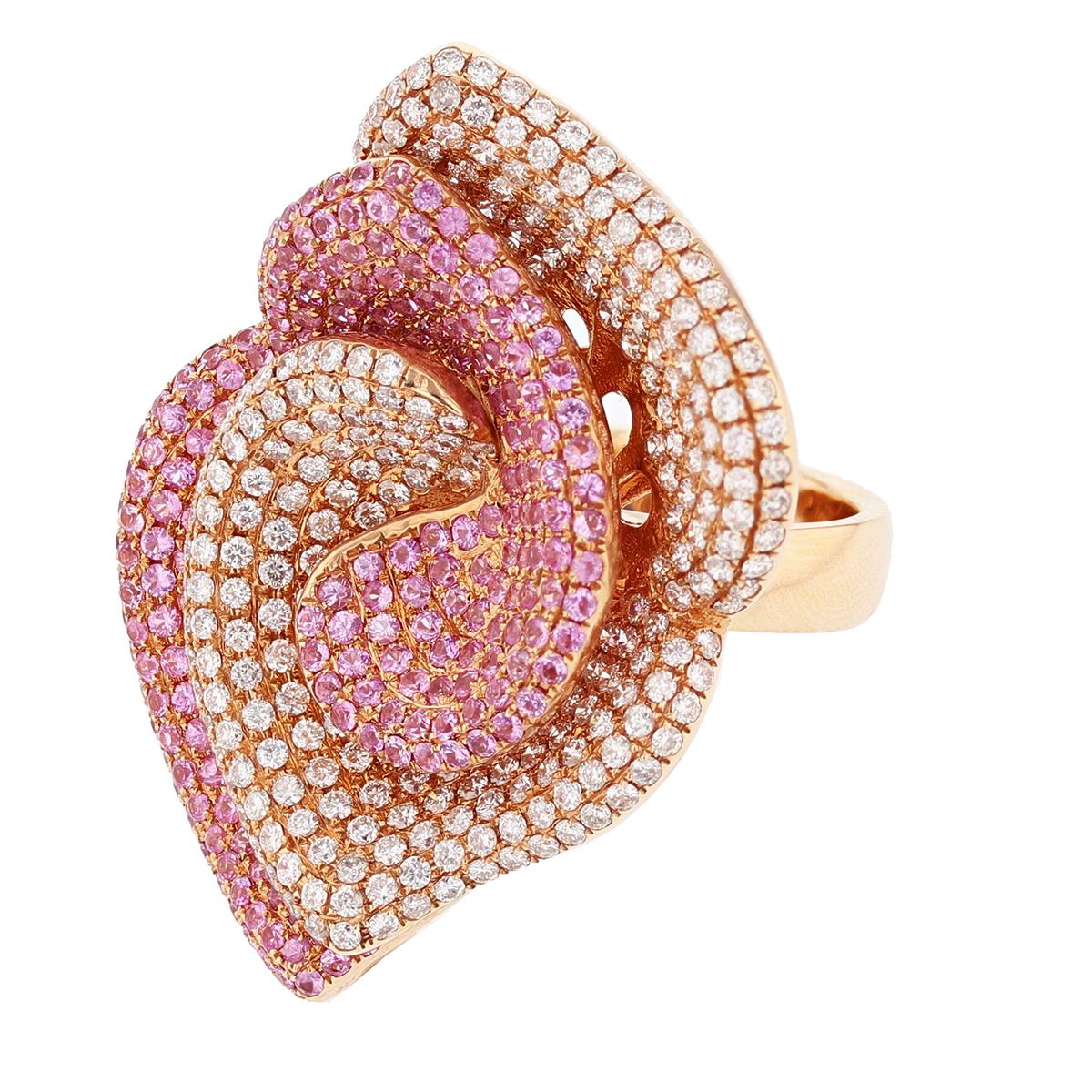 This ring is made in 18k rose gold. The ring features 274 round brilliant cut diamonds weighing 2.70ct and 245 round cut pink sapphires weighing 2.90ct.