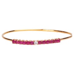 Armband aus 18 Karat Roségold mit Diamanten und Rubinen