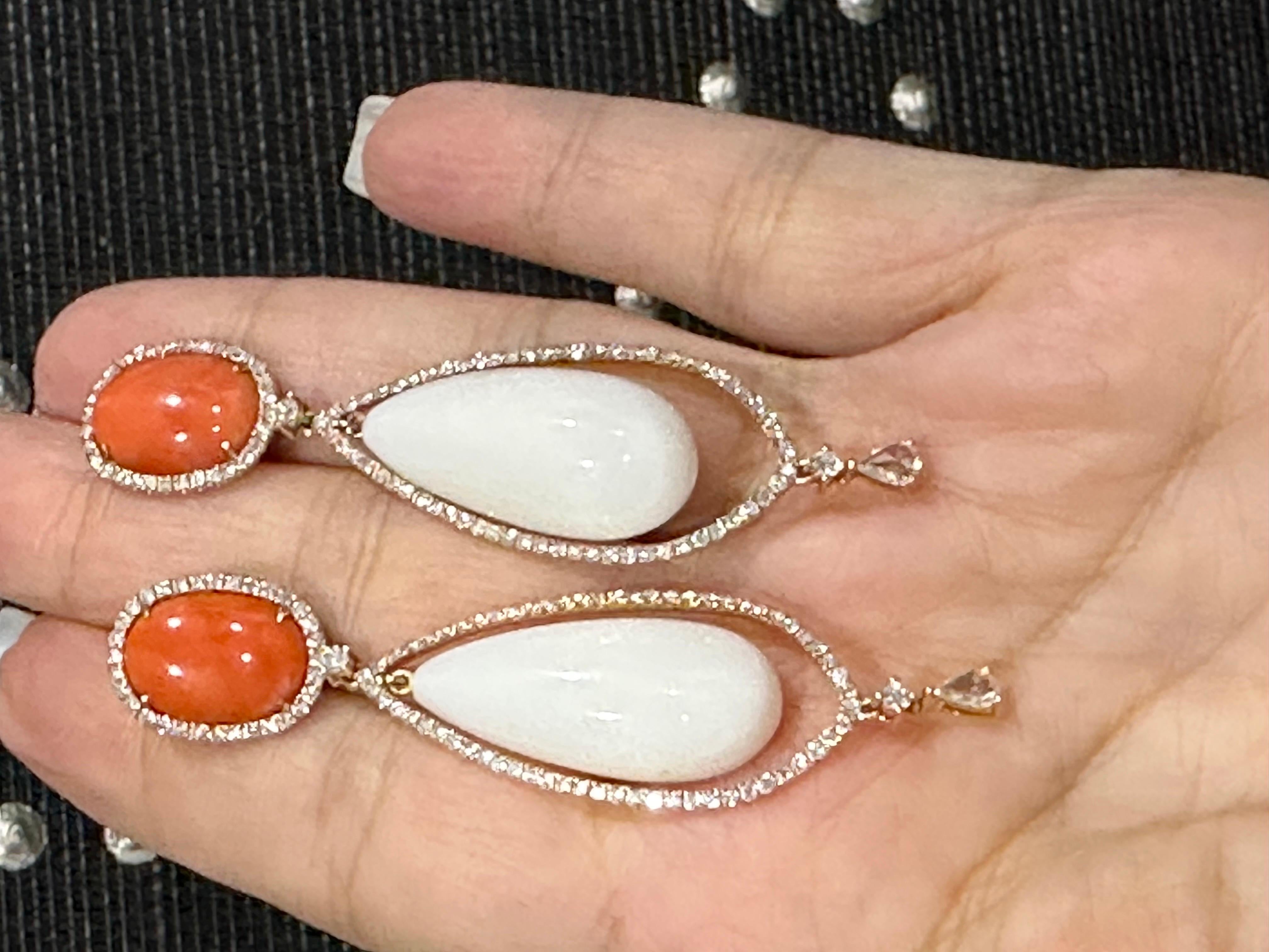Coral is not just for summer! These white and orange/peach coral earrings are surrounded by round brilliant diamonds and a pear shape rose cut diamond glistening on bottom. Style with your winter white sweaters little black dress.
Appprox. 1.25+