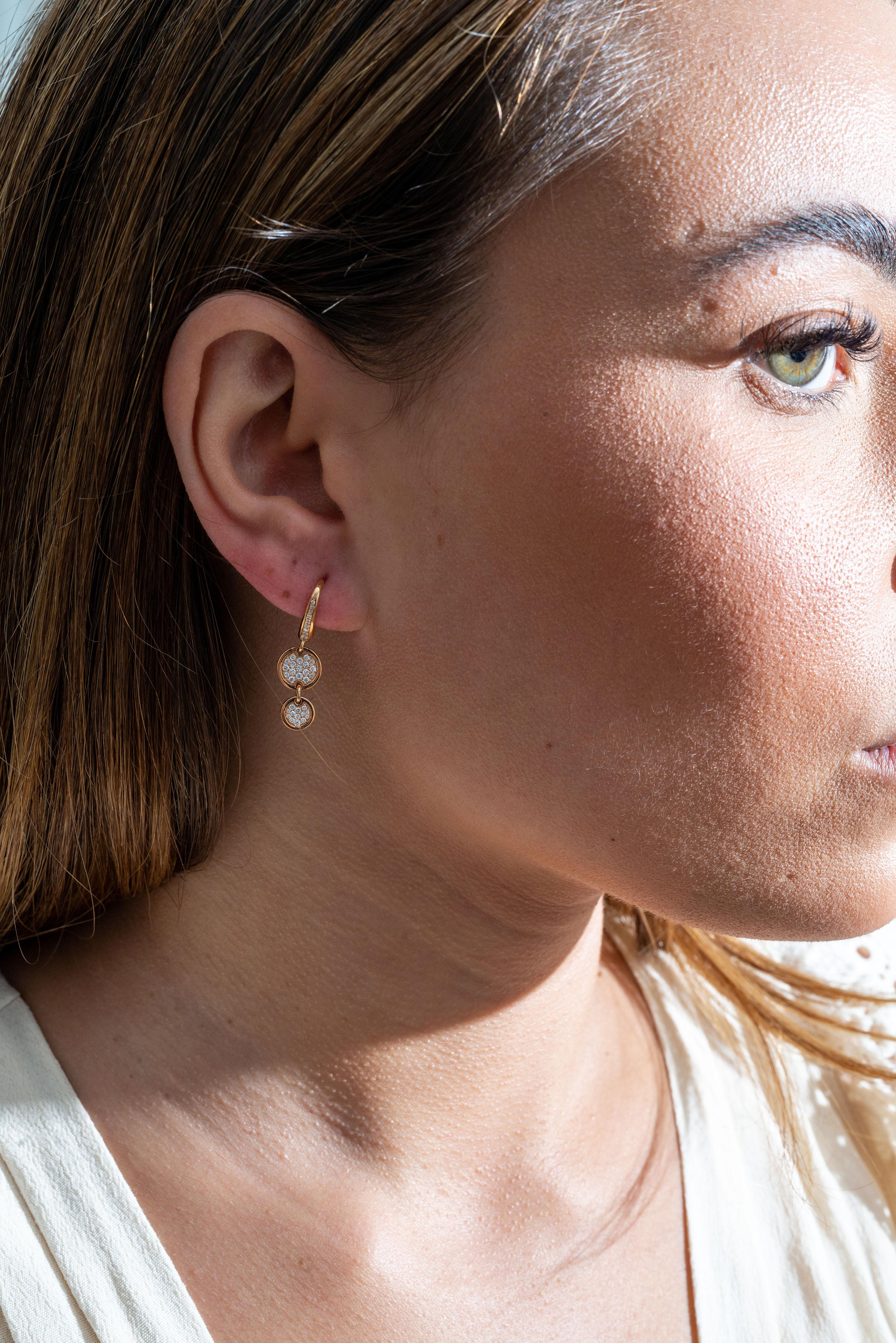 18K rose gold earrings are from Jackpot Collection. These stylish earrings are made of 2 circles each decorated by round colourless diamonds in total of 0.37 Carat. Total metal weight is 4.28 gr. The earrings are 3 cm long. Great for any occasion!