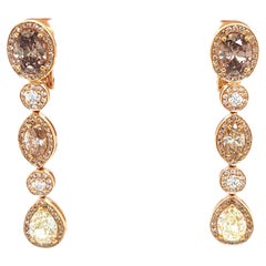 Boucles d'oreilles pendantes en or rose 18 carats et diamants