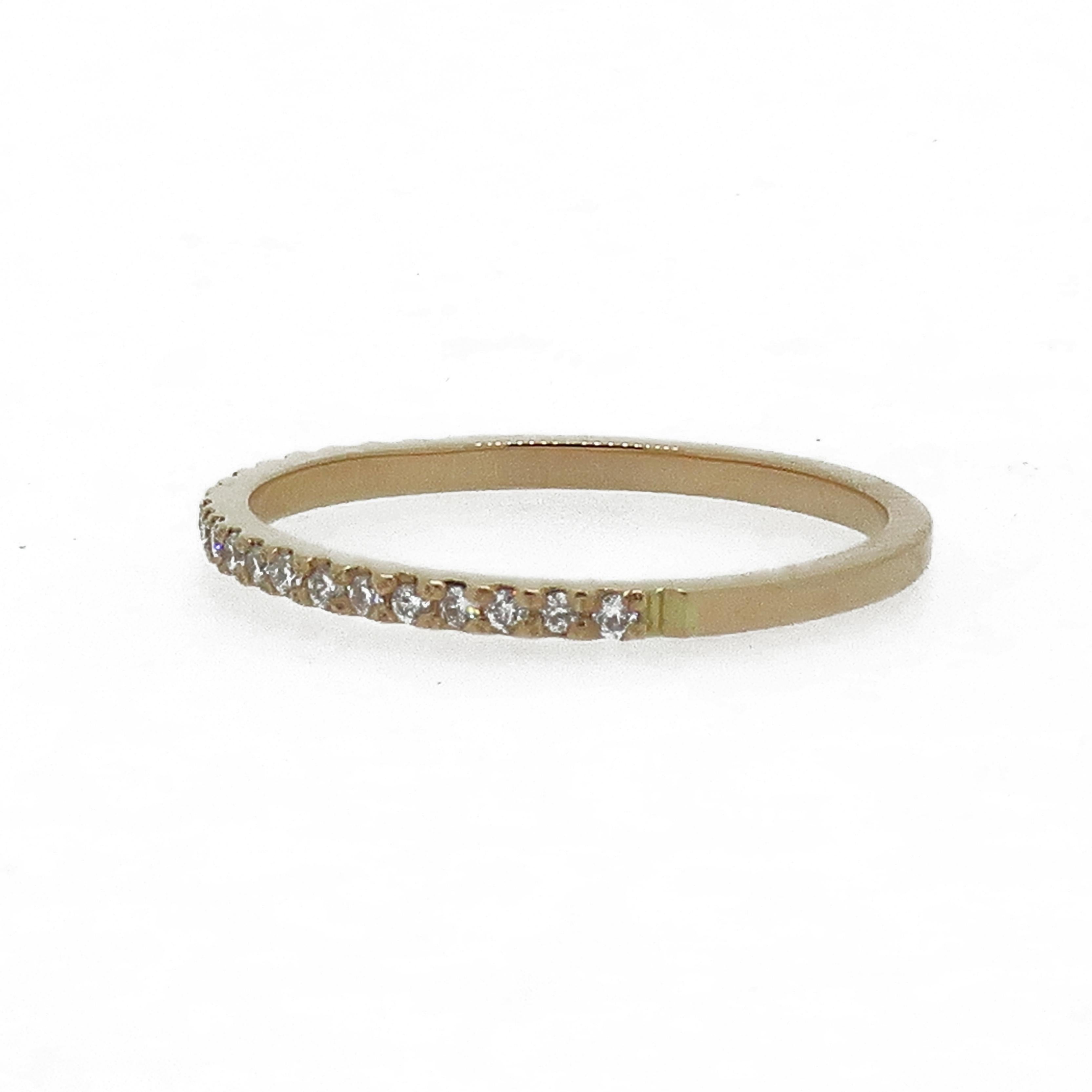18 Karat Rose Gold Diamond Eternity Band Ring

A dainty diamond eternity ring. Consisting of twenty-one small brilliant cut diamonds all in a micro claw setting. All mounted in 18ct rose gold.
This would make the perfect wedding band or simply just