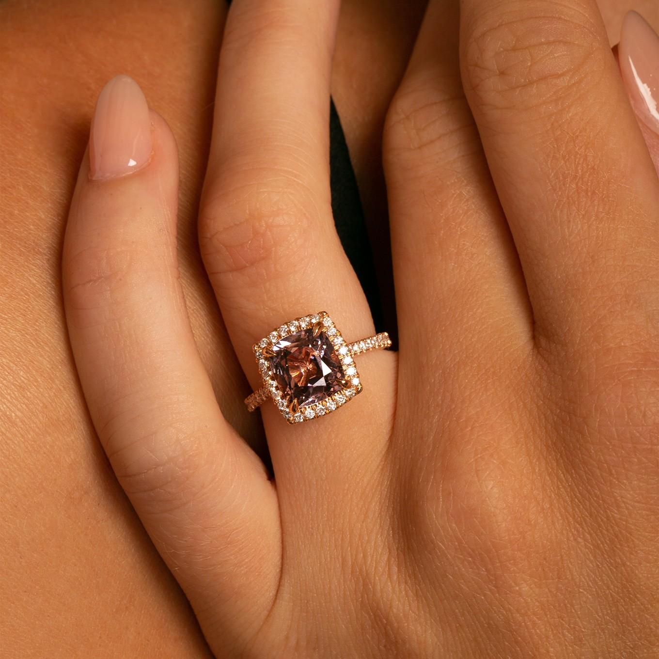 Product Description

This exquisite piece features a 3.03 tcw Lavender Spinel, gracefully encircled by a halo of scintillating, VS-quality diamonds. The diamond setting is meticulously handcrafted, showcasing the unparalleled artistry and attention