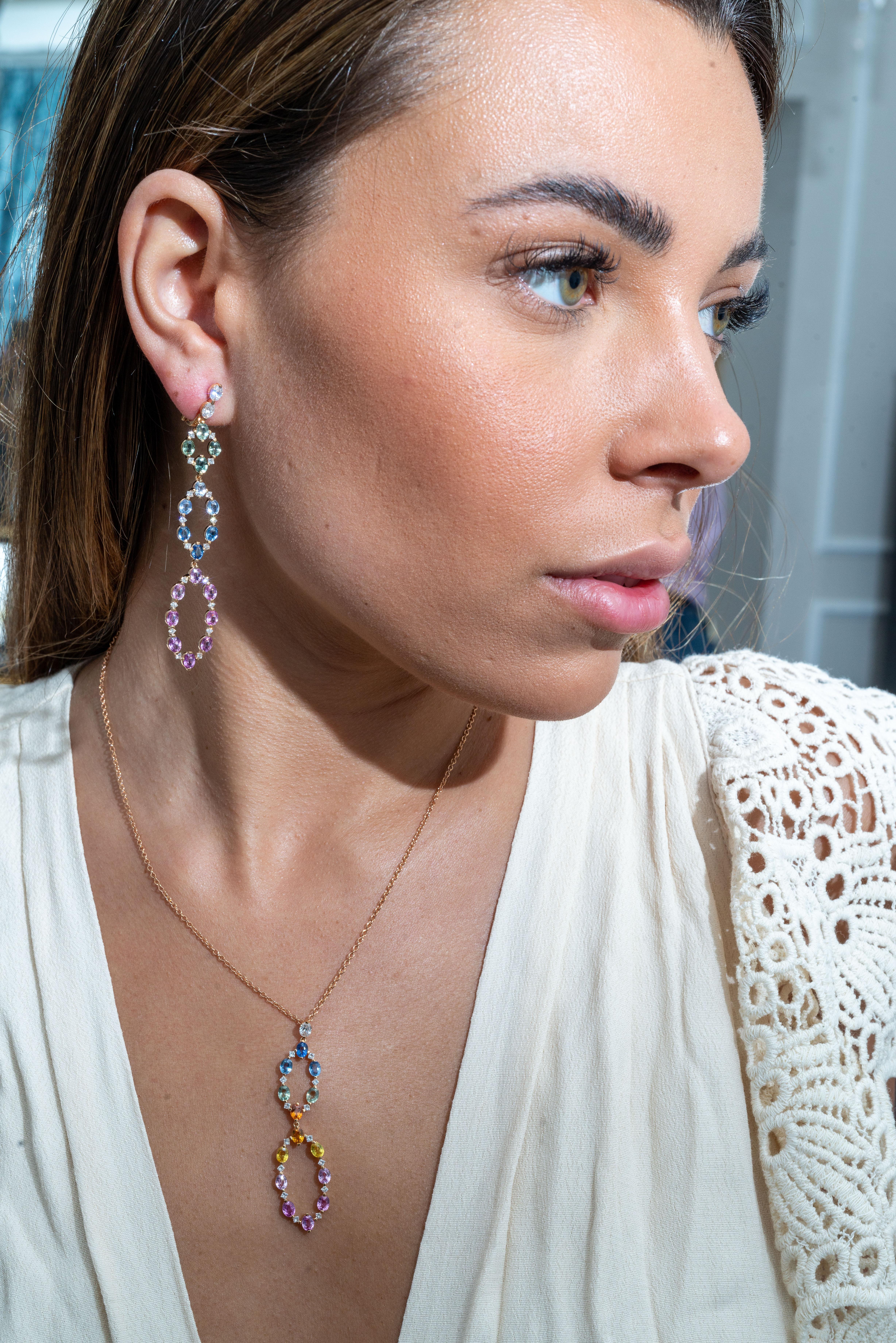 This 18K rose gold elegant chandelier earrings are from our Riad collection. These alluring earrings are made of oval shape multi-coloured sapphires in total of 8.68 Carat and natural white diamonds in total of 1.37 Carat. The total metal weight is