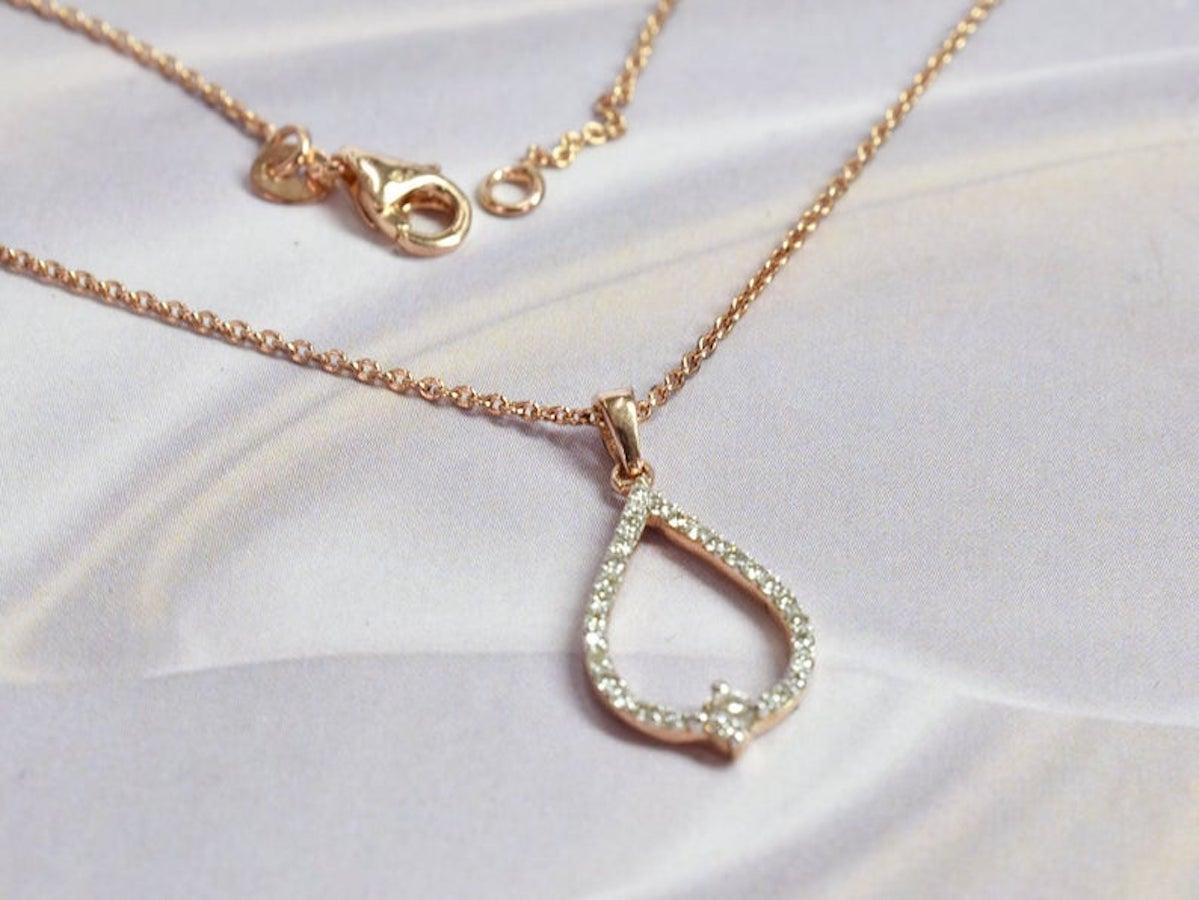 Delicate and beautifully handcrafted 18k rose gold Pear necklace featured with sparkly natural white diamonds. Pave handset by a master setter in Oshi Jewels. A dainty necklace perfect gift for loved ones.

These 100% round-cut diamonds are H color