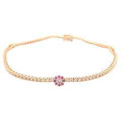 Bracelet en or rose 18 carats avec diamants et rubis