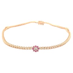 Armband aus 18 Karat Roségold mit Diamanten und Rubinen