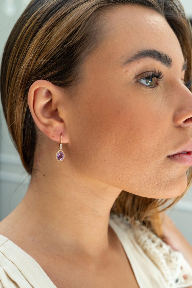 This 18K rose gold elegant drop earrings are from our Riad collection. These drop earrings are made oval shape purple sapphires in total of 3.02 Carat and white diamonds in total of 0.23 Carat. The total metal weight is 3.40 gr. They are 2cm long.