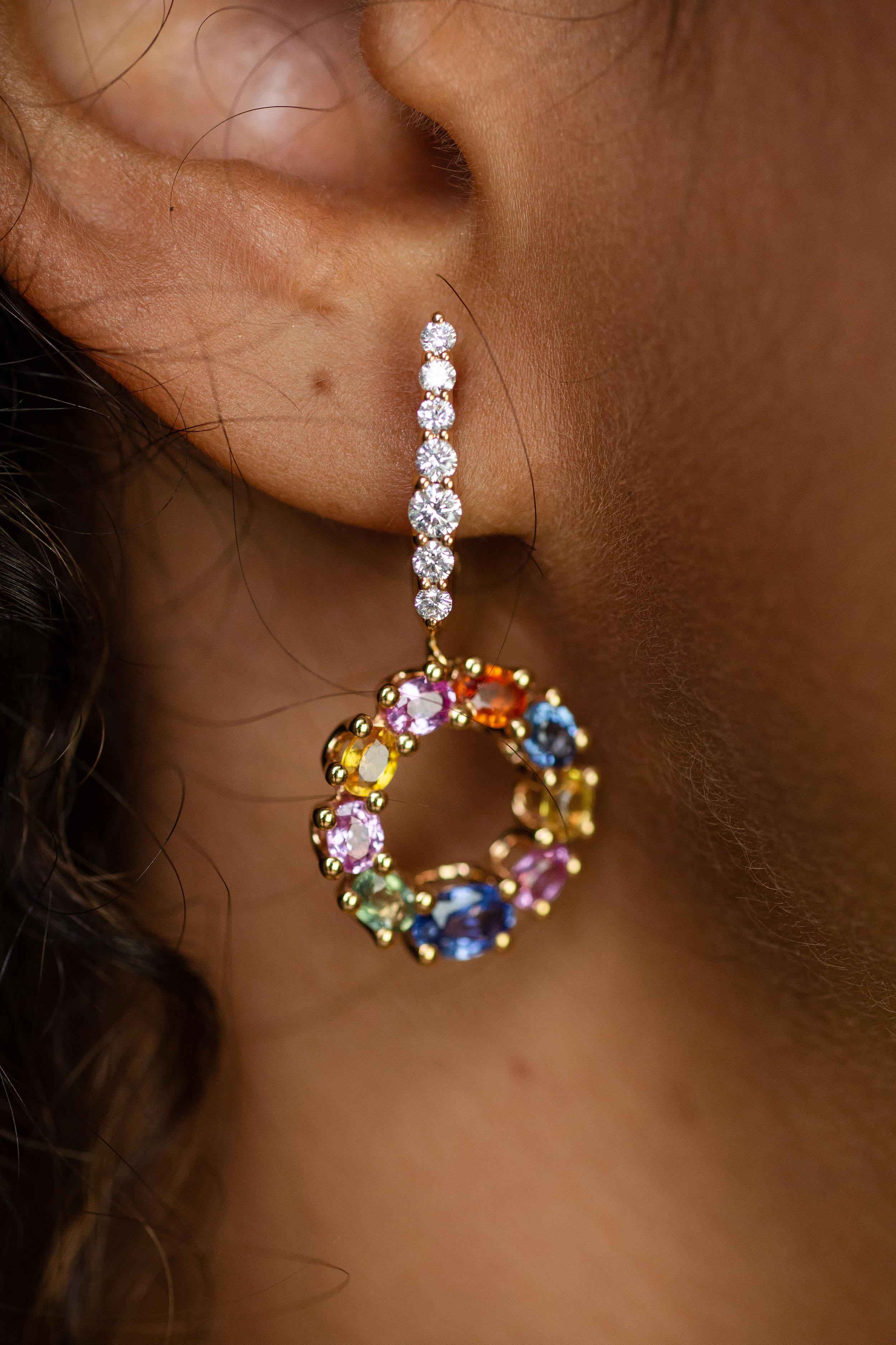 This 18K rose gold drop earrings are from our Riad collection. These drop earrings are made from oval shape  multi-coloured sapphires in total of 4.75 Carat and round white diamonds in total of 0.58 Carat. The total metal weight is 9.30 gr. They are
