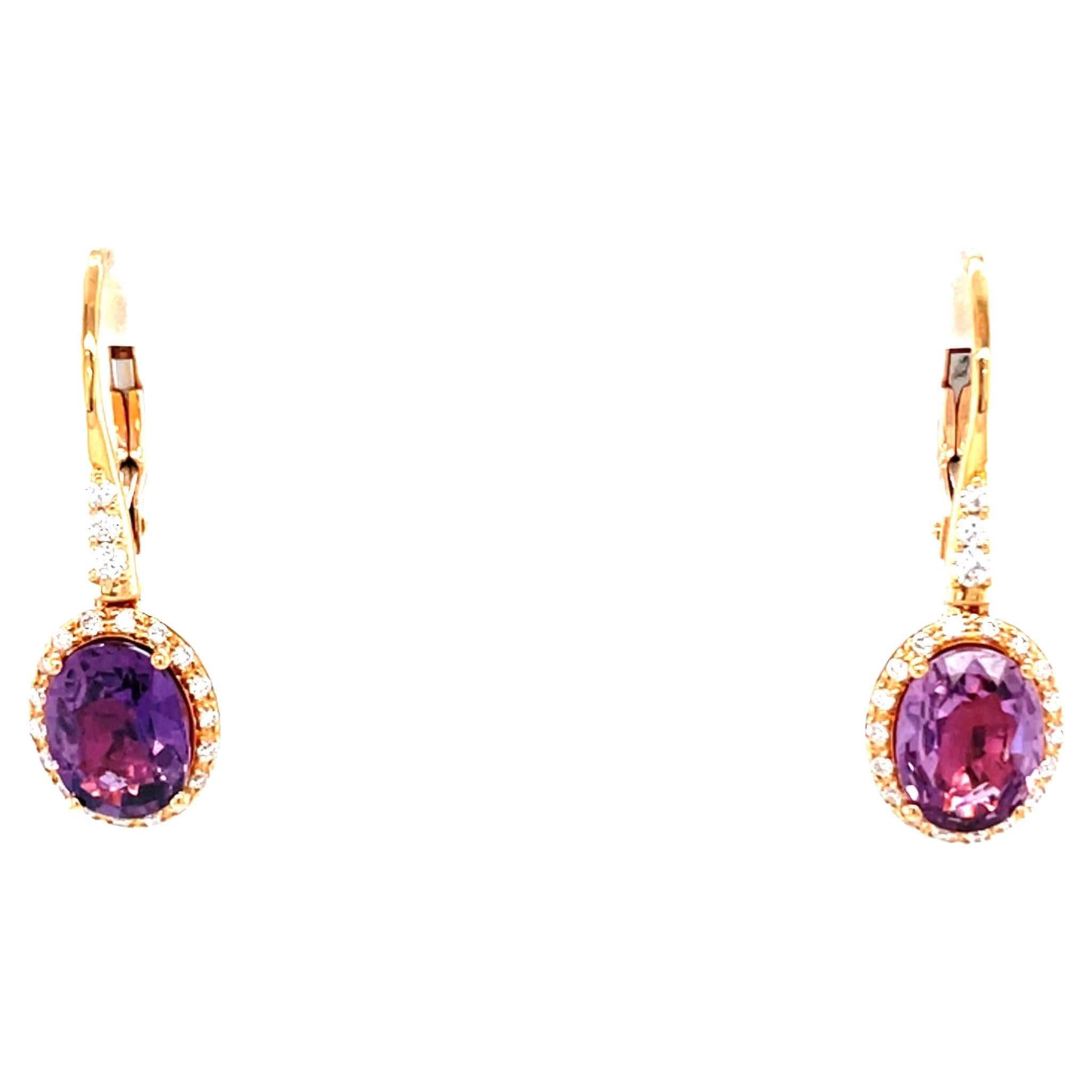 Boucles d'oreilles pendantes en or rose 18 carats avec diamants et saphirs
