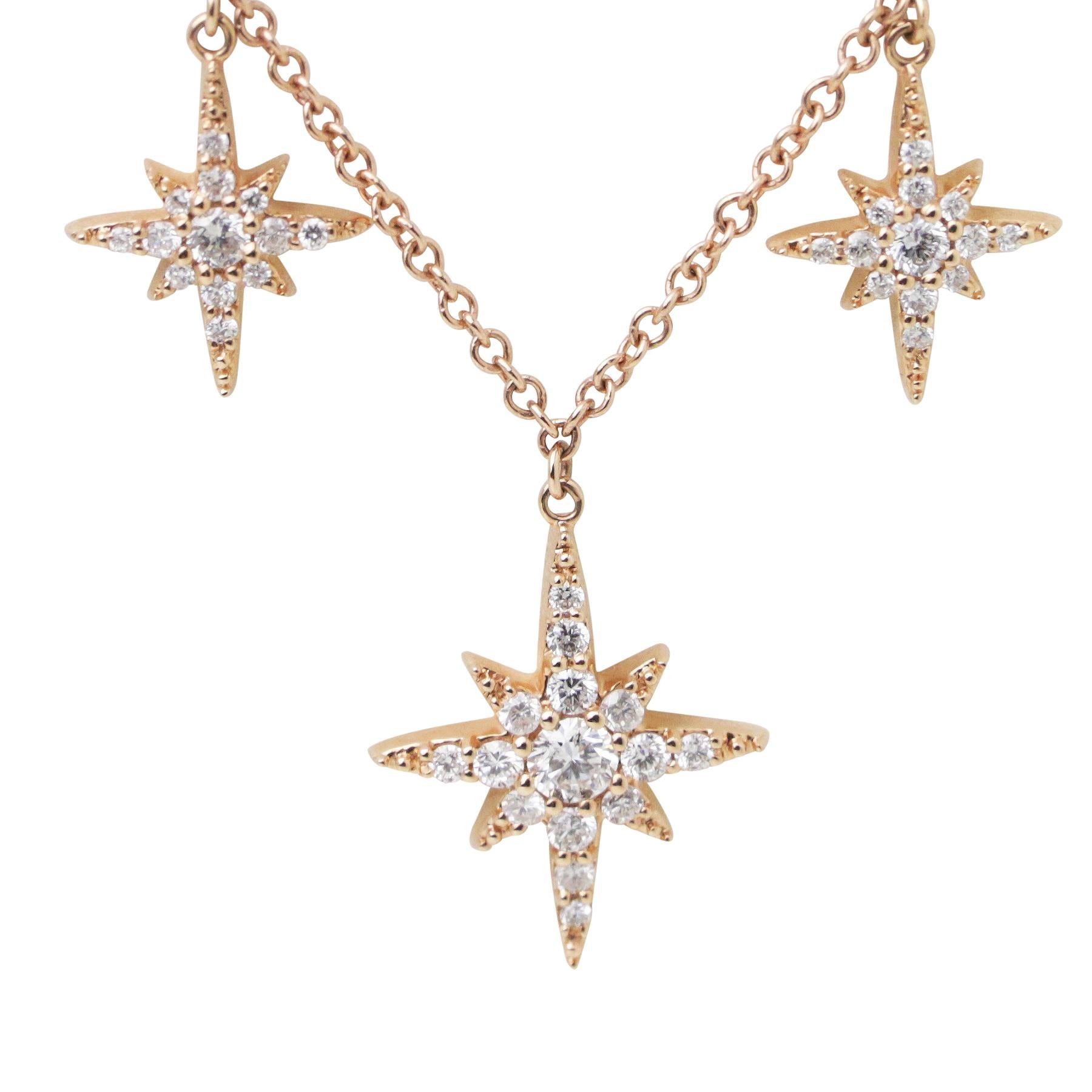 How pretty is this diamond star necklace? Love the way the diamond stars twinkle with every movement. Crafted in 18k rose gold with 5 stars graduating in size - the central largest star is 7.75mm in length and has small brilliant cut diamonds,