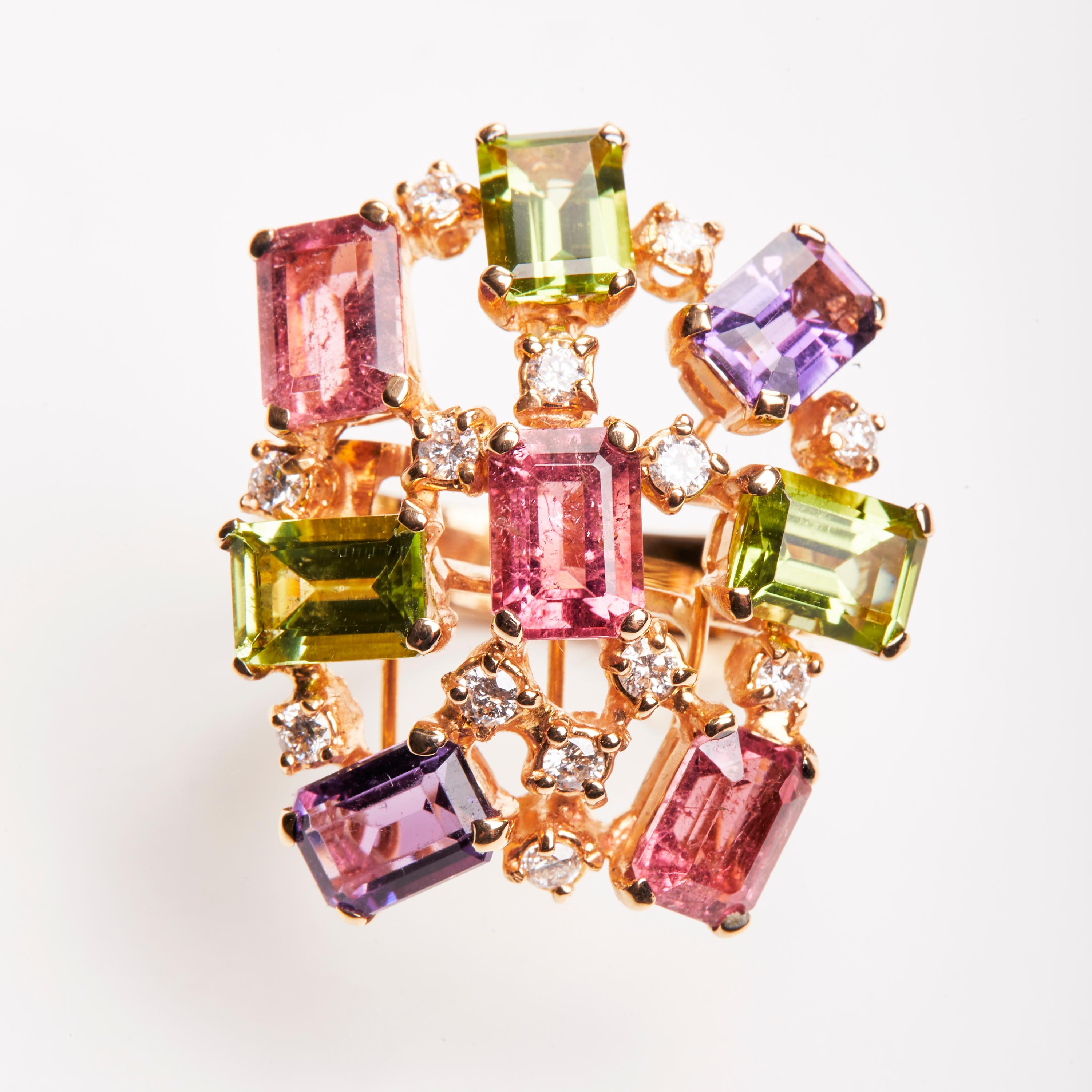 This 18 Karat Rose Gold Cluster Ring is truly exuberant. Diamonds accenting the beautiful array of colorful Tourmaline, Amethyst and Peridot. A perfect compliment to our 18 Karat Rose Gold Diamond Tourmaline Amethyst and Peridot Cluster