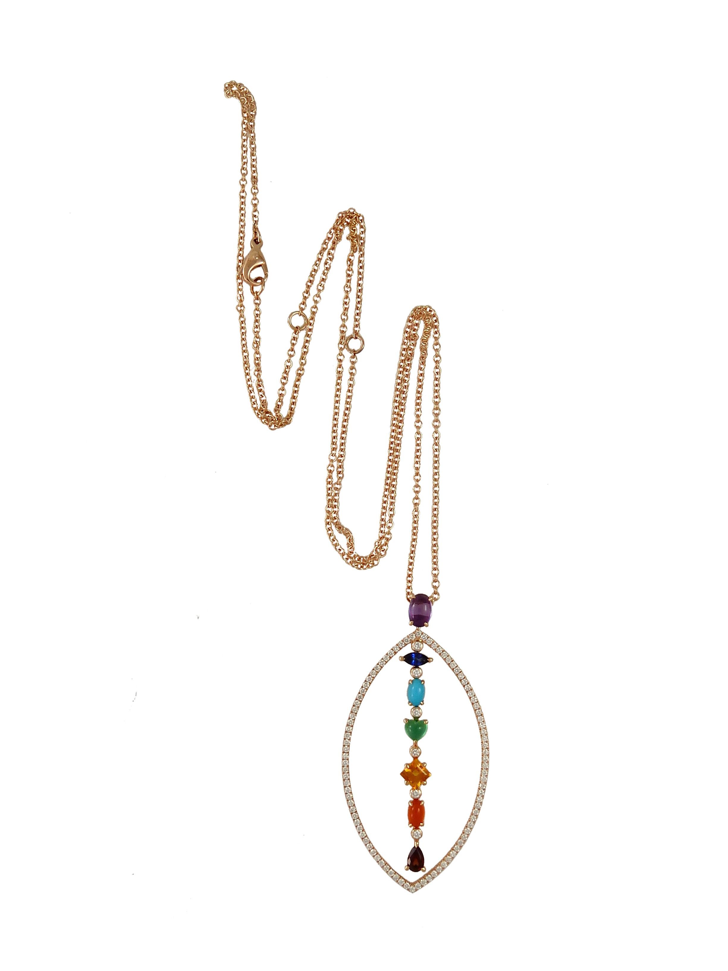 AURA : A white gold, diamonds and colored stones Chakra pendant by Frederique Berman.
This design symbolizes the perfect alignment of the seven main chakras, when open and blooming, so the circulating energy  creates a shining halo around the