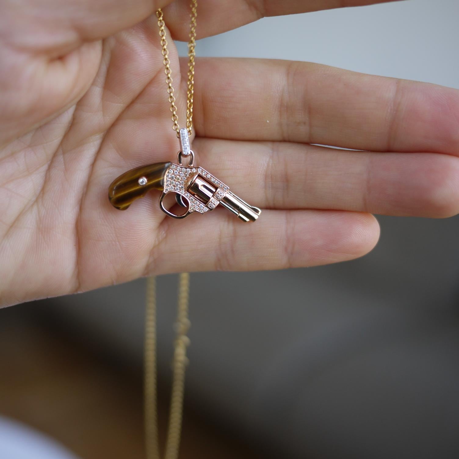 gold revolver pendant