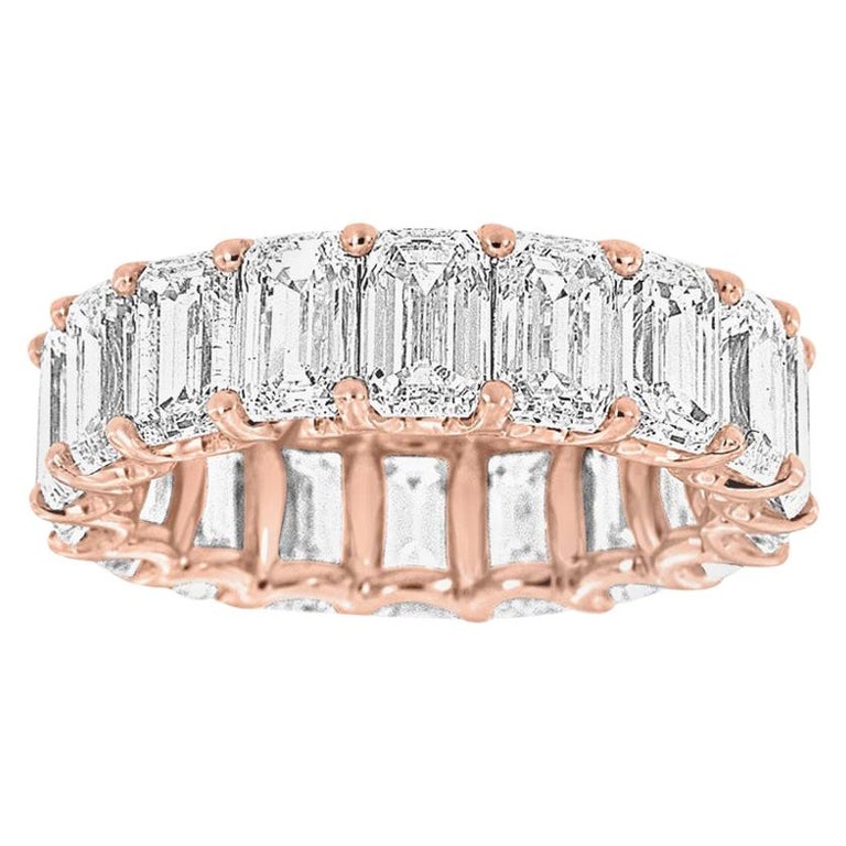 An 18 carat gold emerald and diamond eternity ring RESERVED