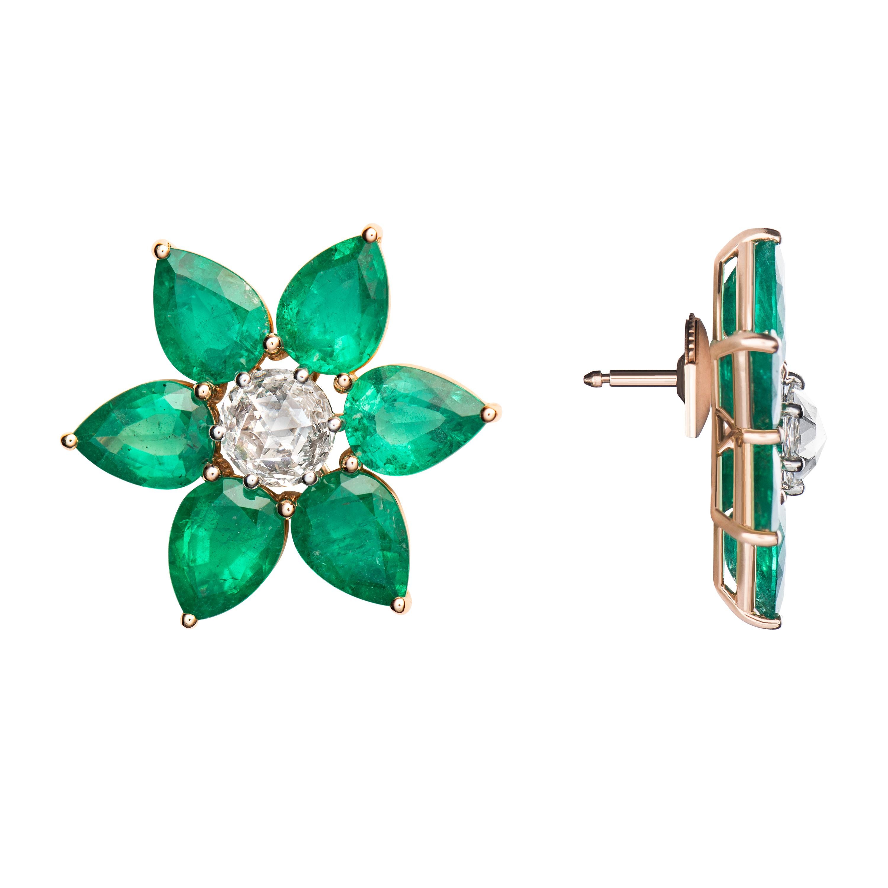 These 18K rose gold handcrafted floral earrings feature round rose cut diamonds in the center each weighing approximately 0.70 ct. and surrounded by  6 pear shaped emeralds each weighing approximately 0.90 ct. 

Emeralds: 11.18 carats
2 Round Rose