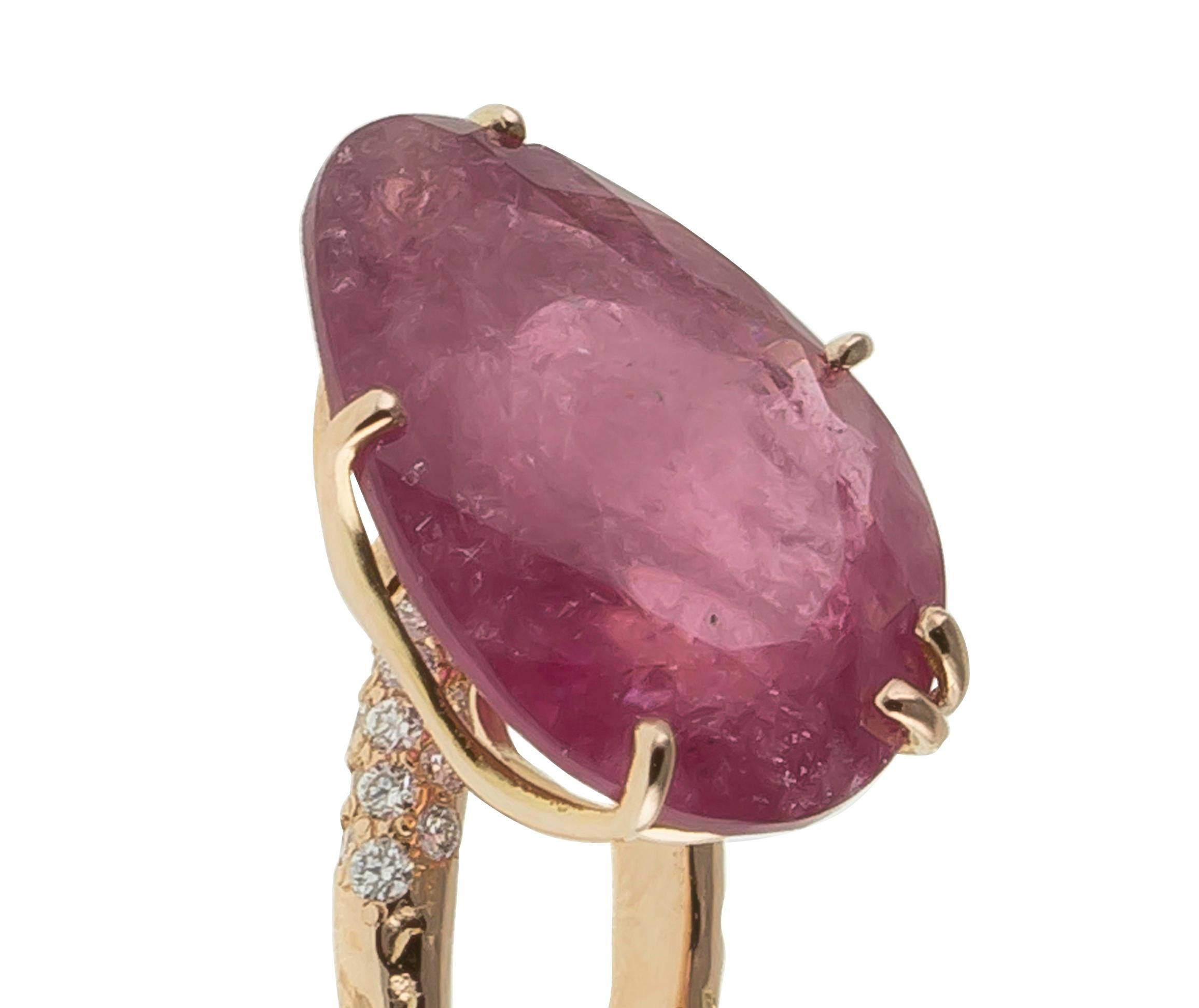 Rubellite and Diamond Cocktail Ring with bubbling head. The ring is in 18 Karat Rose Gold gr. 6,30;  on top of the band at the side of the Rubellite is a  white diamond Carat 0,31 pavè. The Bazilian Rubellite has a unique drop-shaped cut Carat