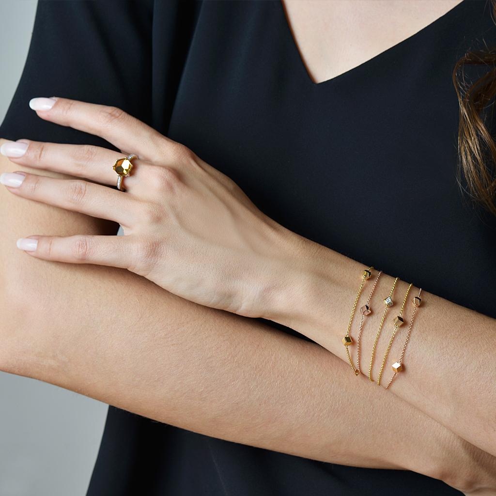 High polish 18kt rose gold Brillante® 'Natalie' station bracelet.

This custom design bracelet by Paolo Costagli features a trio of the iconic Brillante motif in 18kt rose gold. The delicate chain is beautiful when worn on its own but also stacks