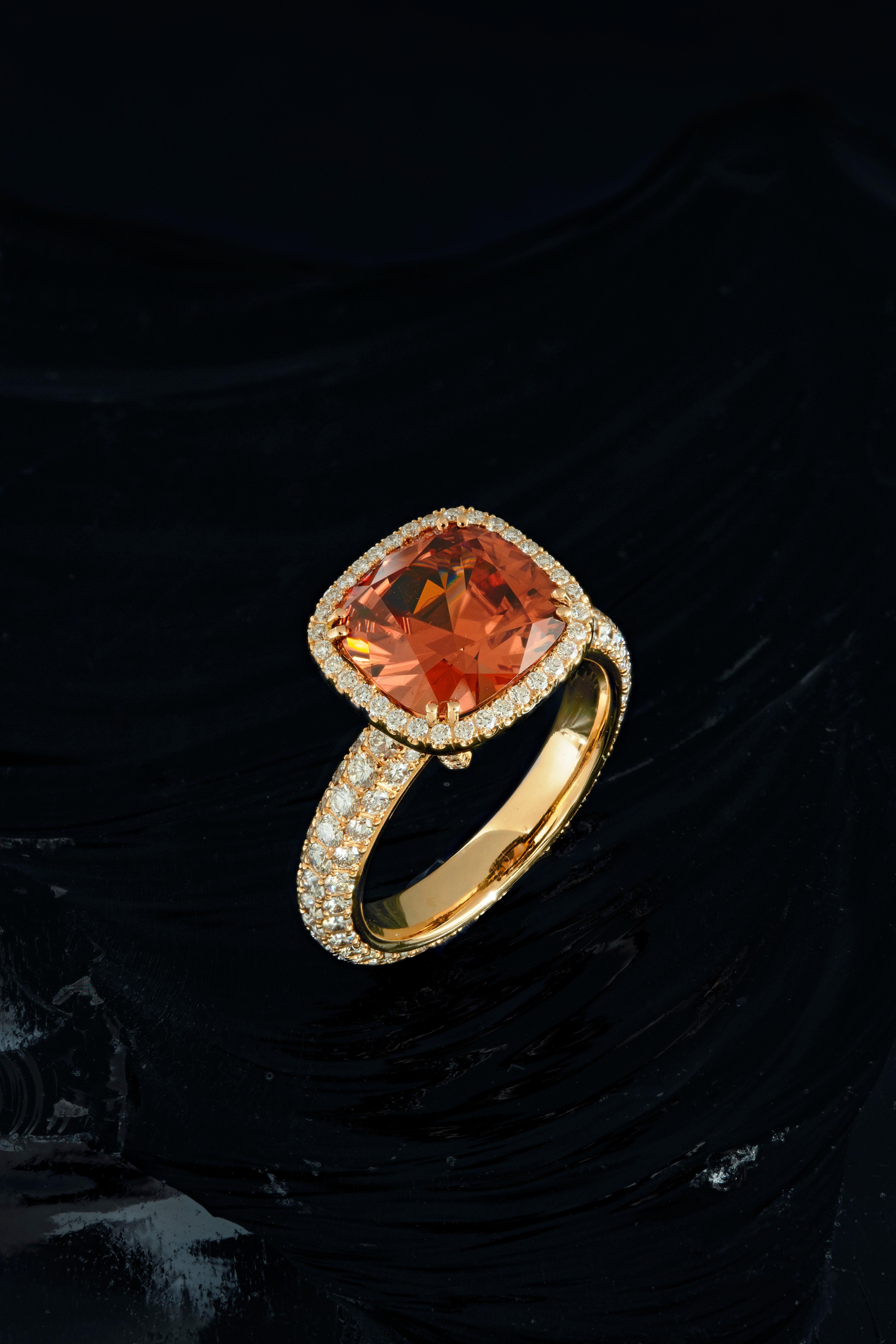 This one-off ring is handmade in Switzerland with a cushion cut Malayan Zircon of 4.97 ct. in entourage of Diamonds of total 1.78 ct. F vvs. It is made in 18K rose gold.
You can expect the best Swiss workmanship and quality.
ring size 55