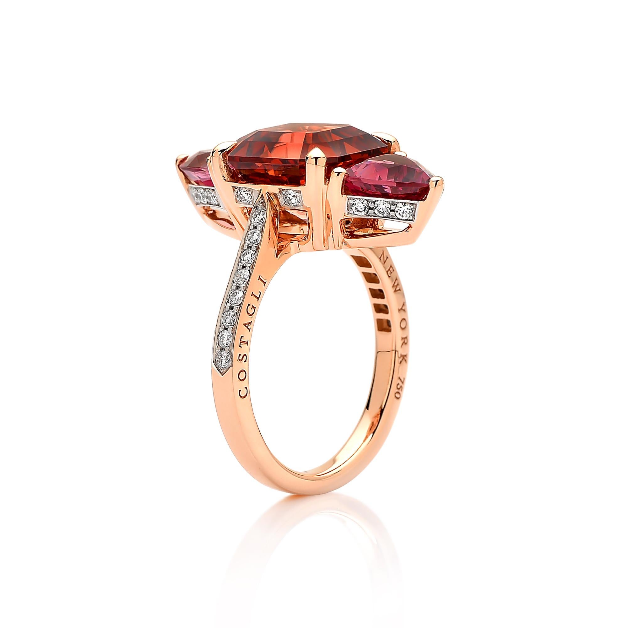 One of a kind emerald cut Mahenge Malaya Garnet ring flanked by trillion shape Malaya Garnets set in 18kt rose gold with pave-set round, brilliant diamond detailing.

This ring features a bold and modern silhouette of the exquisitely cut garnet