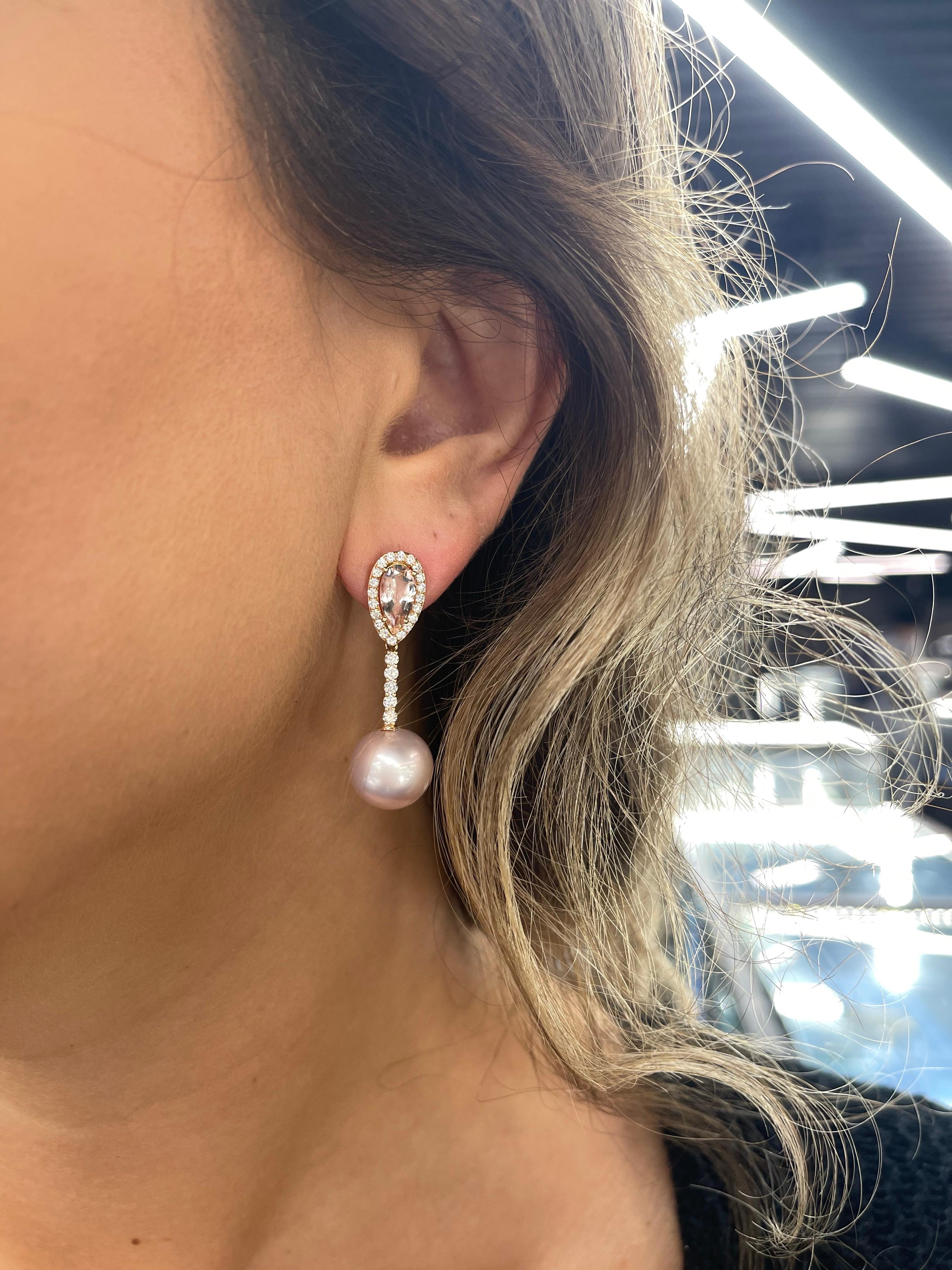 18 Karat Rose gold drop earrings featuring two Pear shape Morganite weighing 2.04 carats flanked with 50 round brilliants weighing 0.76 carats and two Pink Freshwater Pearls measuring 12-13 MM.
