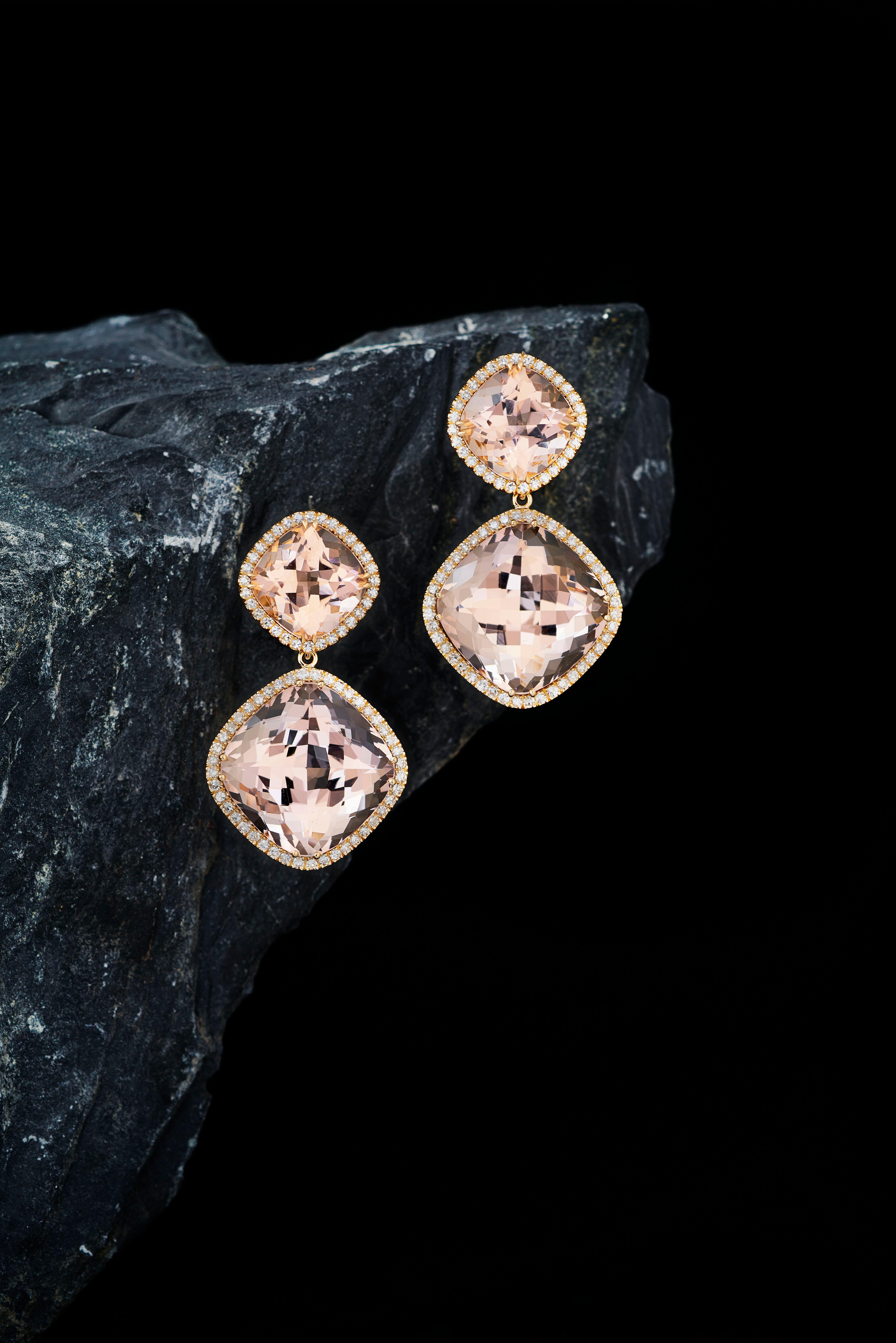 These one-off earrings are handmade in Switzerland. The earrings are made in 18K rose gold (4N) with two cushion cut Morganites of total 33.49 ct. in entourage of 88 Diamonds of total 0.69 ct. F-G vs. These detachable earrings need to be purchased