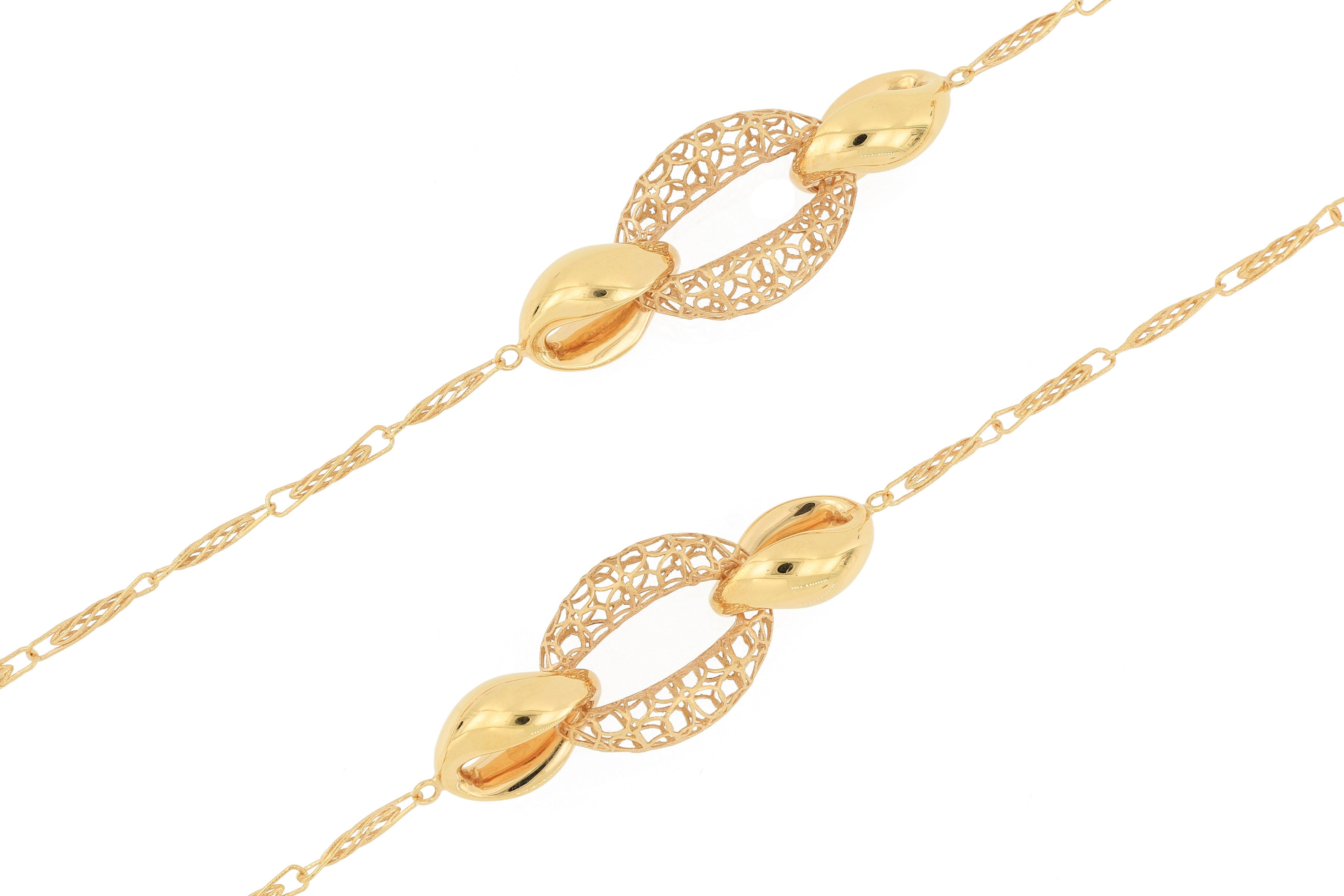 This 18 karat gold necklace is Italian made, with exquisite craftsmanship, hollowed out and beautifully designed. The entire chain body is interlocked with detailed structure.  This mix and match necklace is simply a piece of art, especially