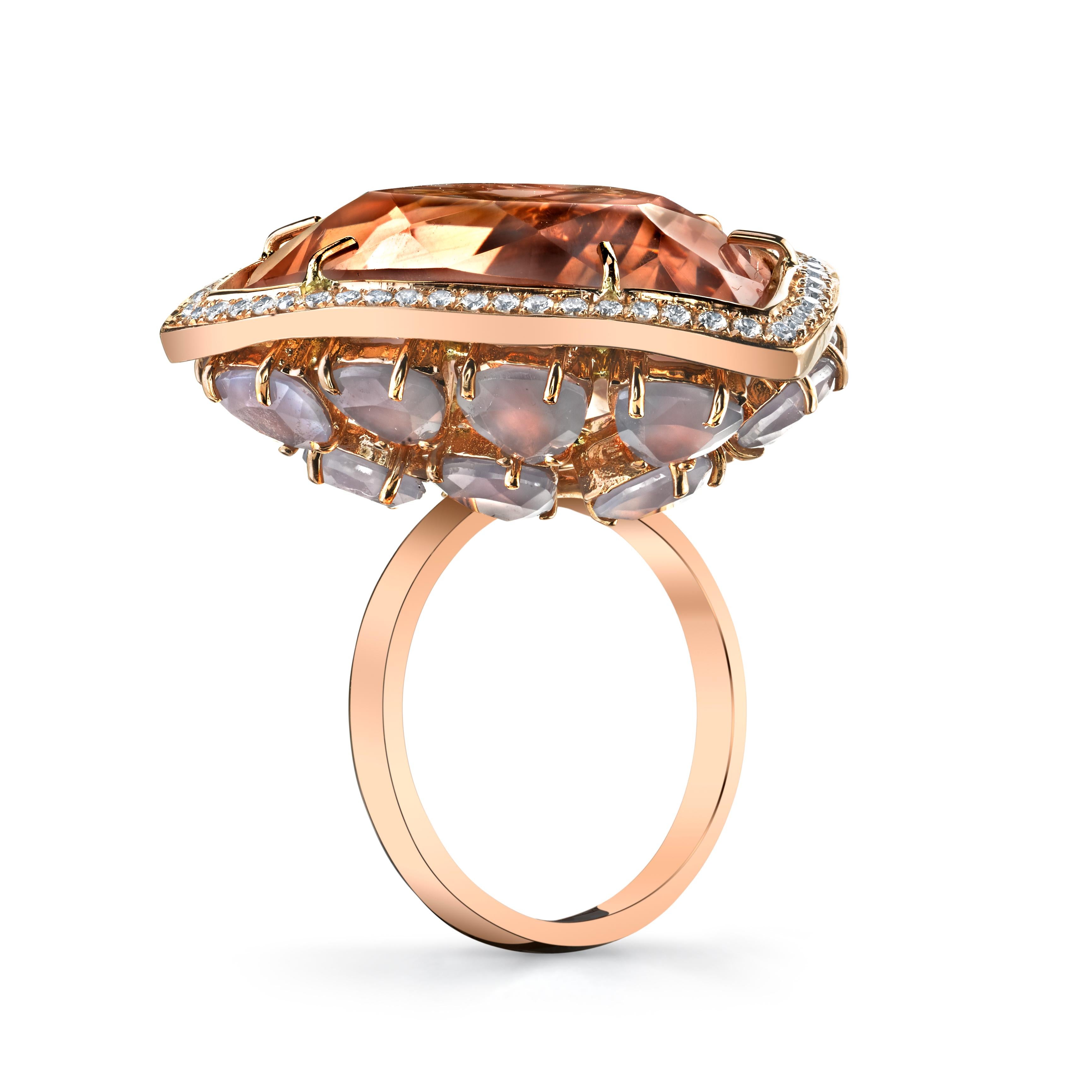Pink Rose Quartz Horizon Ring features a large custom triangle-cut rose quartz framed with a bezel of white diamonds and supported by a covert bejeweled under gallery of custom triangle-cut opals. 

18k Rose Gold
Rose Quartz
Opals
White Diamonds