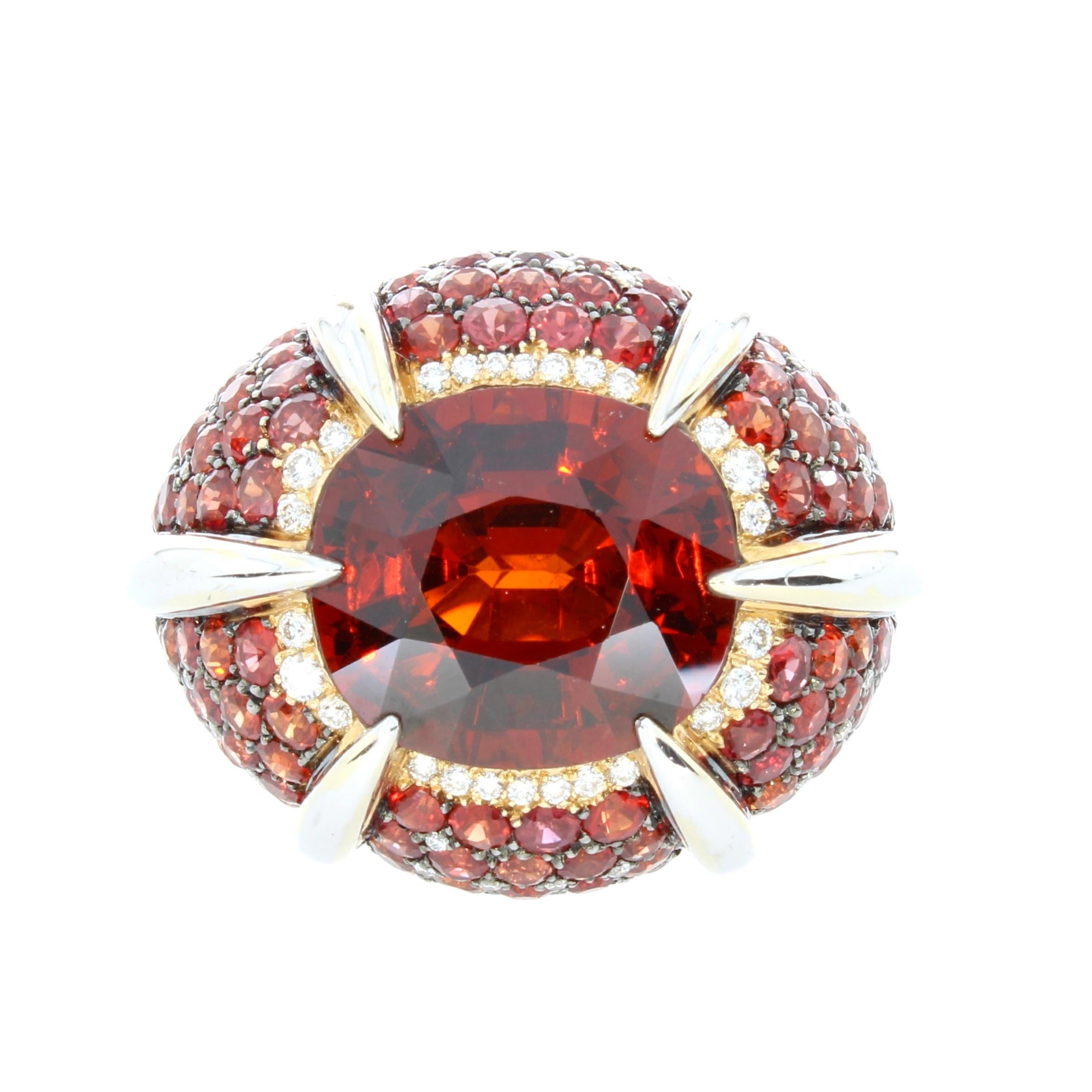 A deeply hued orange garnet sits boldly upon a scintillating pave of orange sapphires, surrounded by brilliant cut diamonds and embraced in this opulent design.

Orange Garnet Sapphire and Diamond Signature cocktail Ring
18 karat Rose Gold
15.82