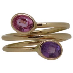 18 Karat Rose Gold Oval Pink and Purple Sapphire Two-Stone Cross Over Ring
