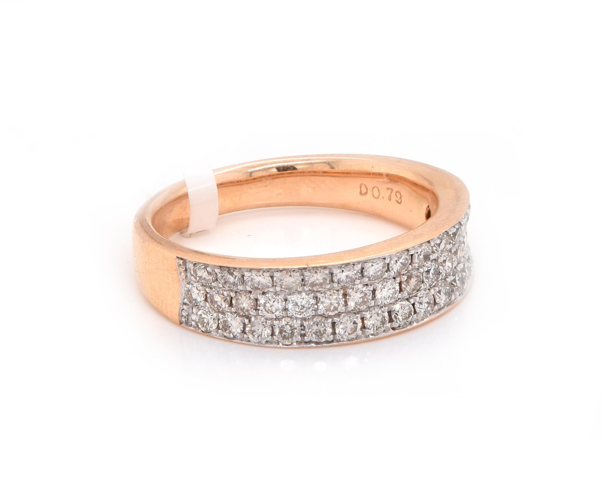 Designer: Custom
Material: 18K rose gold
Diamonds: 47 round cut = .79cttw
Color: G
Clarity: VS
Size: 6.75
Dimensions: ring measures 5.5mm in width
Weight: 4.45 grams

