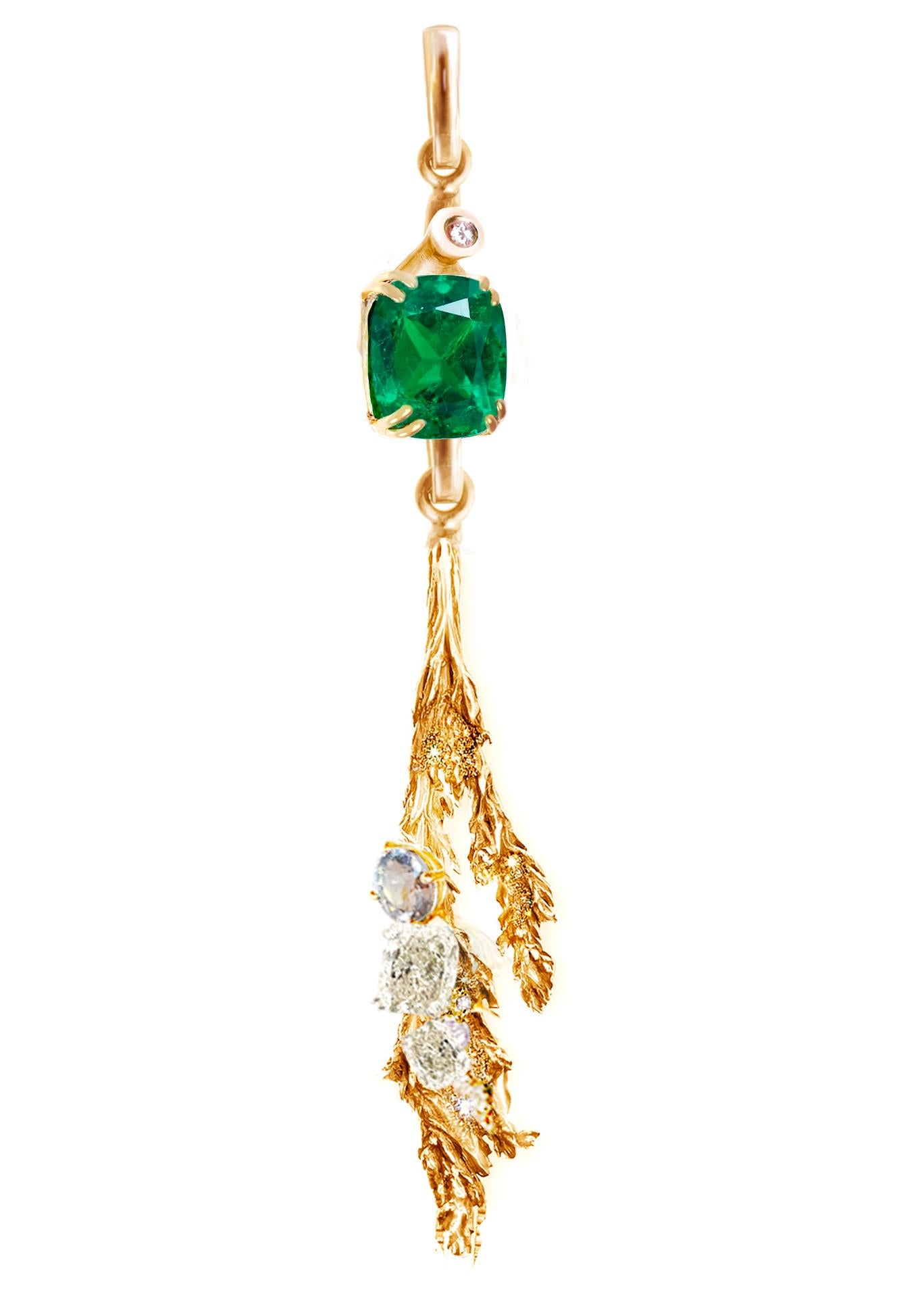 This 18 karat rose gold Juniper pendant necklace is 6 cm long and is encrusted with a cushion-cut 5.45 carat emerald, GIA certified diamonds, and a sapphire. The dimensions of the emerald are 11.2x10 mm, and two of the diamonds are SI, F/H, GIA