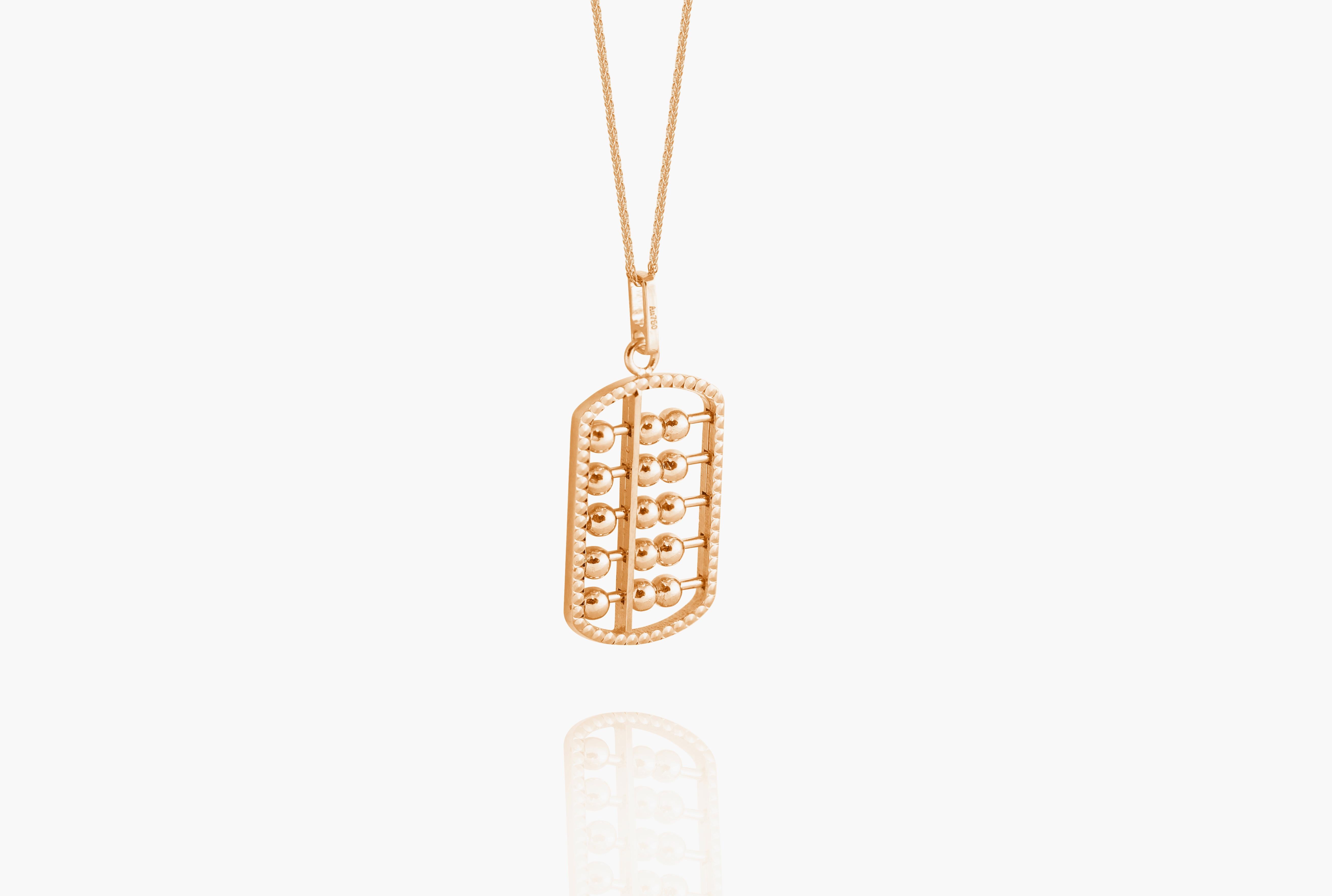 Abacus pendant with moving beads mounted in 18 Karat rose gold.
Abacus, invented in ancient China  more than 2,600 years ago, is a traditional computing tool for businesses and widely used in Asian countries before the modern calculator was