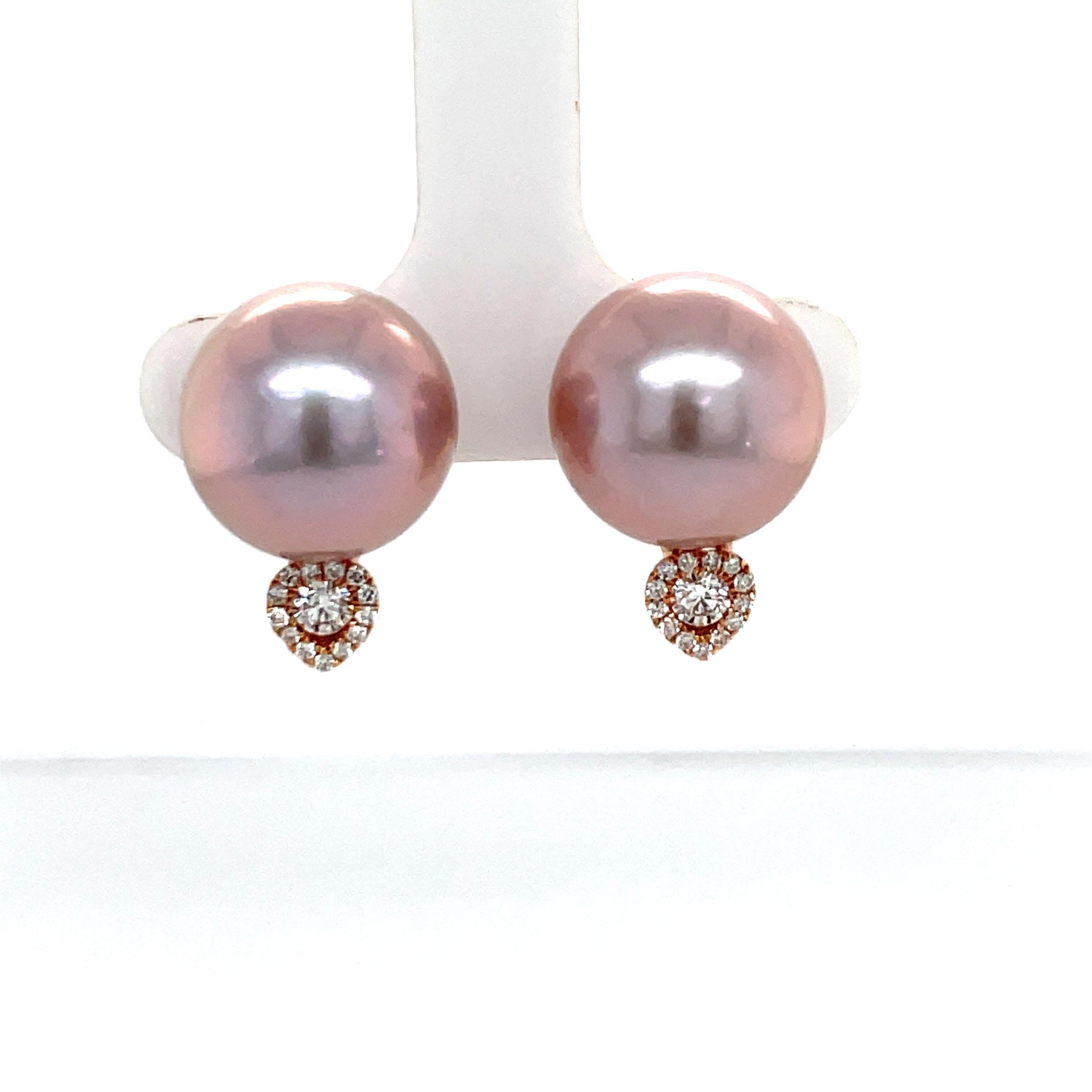 18 Karat Rose Gold stud earring featuring one Pink Freshwater Pearl measuring 12-13 MM with 2 round brilliants weighing 0.17 carats with a diamond halo weighing 0.10 carats. 
Color G-H
Clarity SI