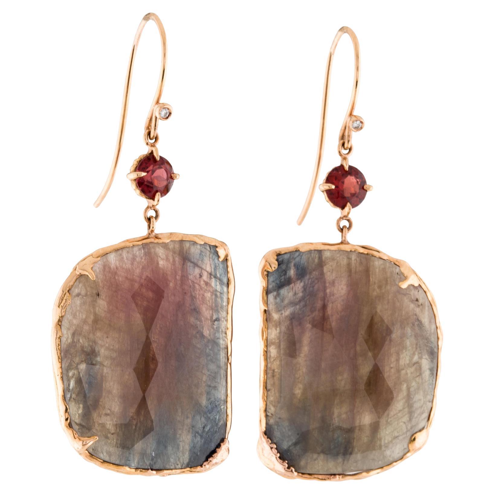 The 18 Karat Rose Gold Red Slice Sapphire Dangle Earrings are a stunning and unique addition to any jewelry collection. The earrings feature a mesmerizing red Sapphire slice that is complemented by the sparkle of .01ct diamonds and 1.25ct round