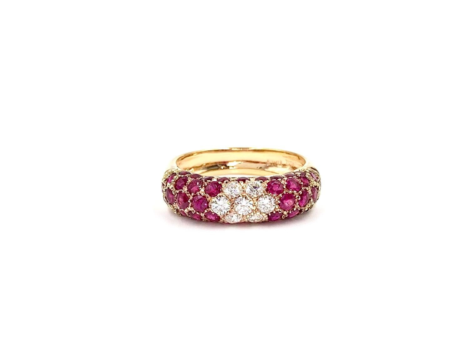 A very well made and wearable slightly domed 6mm polished 18 karat rose gold band ring featuring 2.40 carats of vibrant rubies and .40 carats of round brilliant white diamonds. White diamonds are of high quality at approximately F color, VS2 clarity