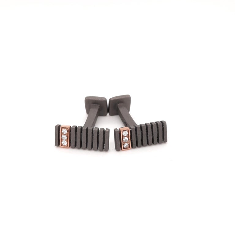 These titanium cufflinks are from Men's Collection. Each cufflink is made from 3 natural round white diamonds placed on 18K rose gold detail.  The total weight of diamonds is 0.06 Carat  The dimensions of the cufflinks are 1.35cm x 0.5cm. These