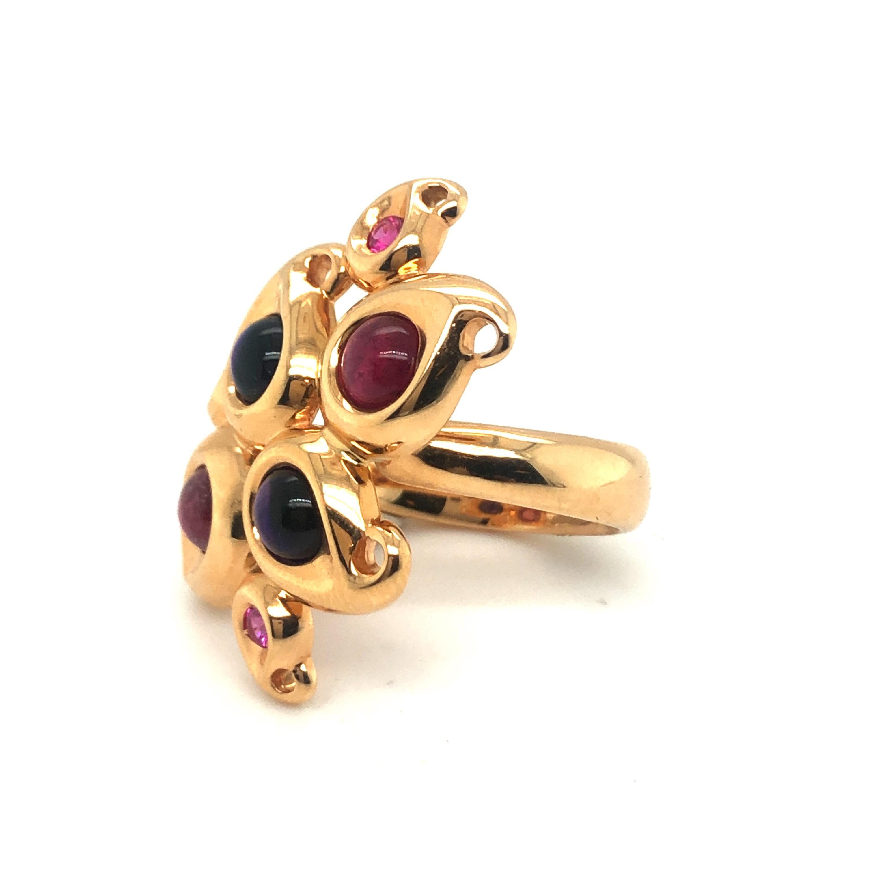 Joyful 18 karat rose gold, pink tourmaline, amethyst and pink sapphire cocktail ring by Tamara Comolli.
Crafted in 18 karat rose gold, the ring head consisting of a cluster of paisley shaped elements set with 2 pink tourmaline cabochons, 2 amethyst