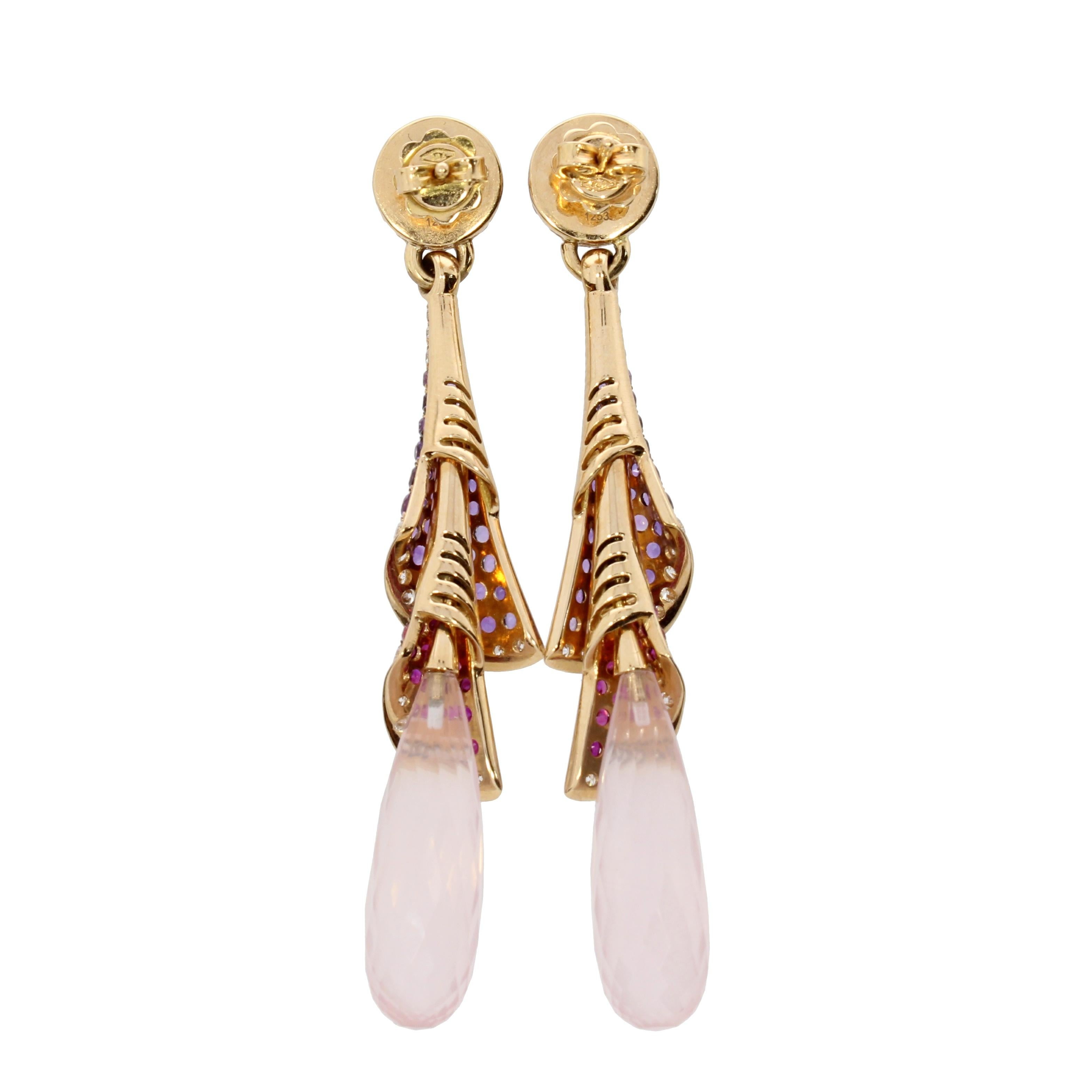 A pink quartz drop hangs gracefully beneath delicate frills of rubies, amethyst and brilliant cut diamonds, to form this elegant and classic silhouette.

Details
Venice Pink Quartz Ruby Amethyst and Diamond Drop Earrings
- 18 karat Rose Gold
- 20.72