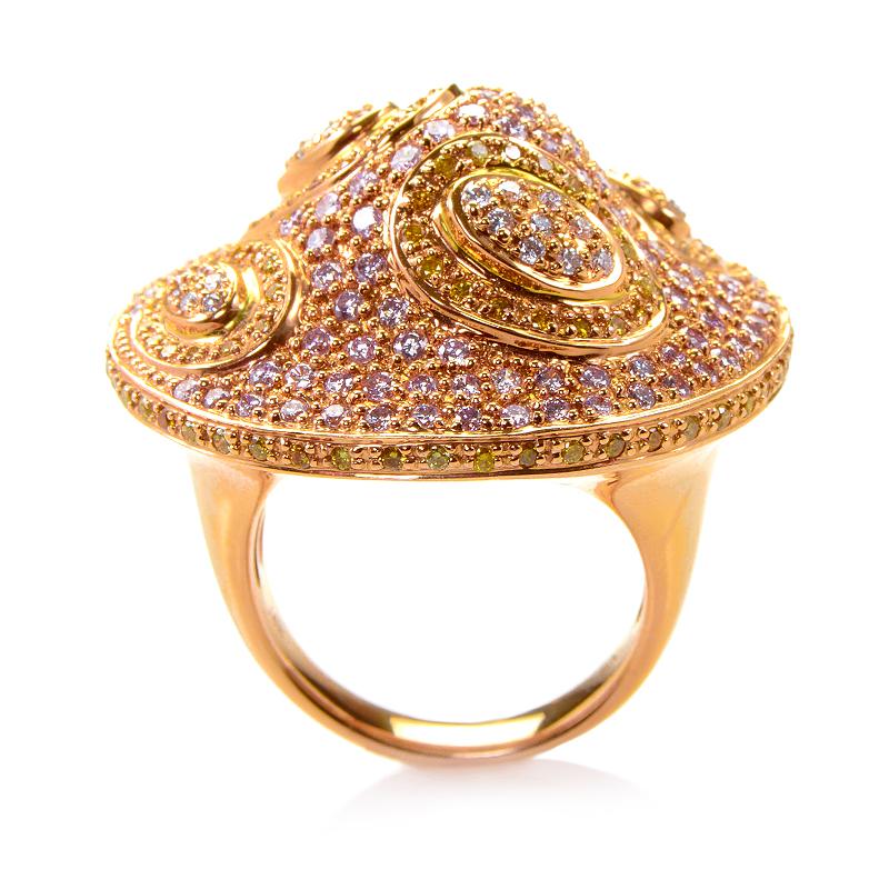 This ring is opulent and shines with diamonds. The setting is made of 18K rose gold and boasts a design that features  ~2.72ct of white and yellow diamonds. 