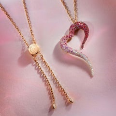 18 Karat Rose Gold, White Diamonds, Rubies and Sapphires Heart Shaped Pendant