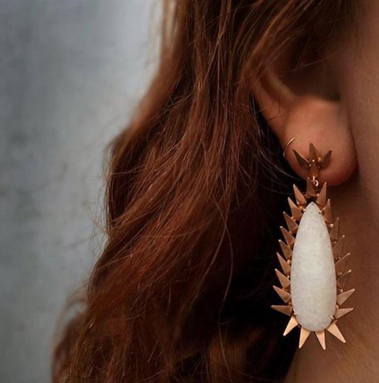 White Jade Fire Drop Earrings feature two large pear shaped white jade stones framed by Karma El Khalil's signature hedgehog spike design set in 18k Rose Gold
18k Rose Gold, White Jade
Includes 18k Rose Gold push closure earring backings 
From Karma