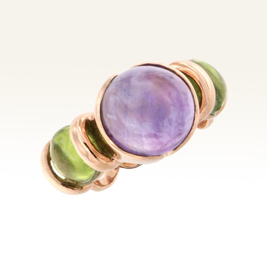 Modern Ring in 18 karat gold with Amethyst and Peridots in round cabochon cut (size: mm 12    small size mm 8 ). 
 Fashion cocktail ring ,amethyst symbolizes the purity of the soul and humility, with its intense purple color protects against