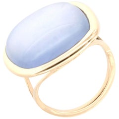 Ring aus 18 Karat Roségold mit Perlmutt und blauem Topas