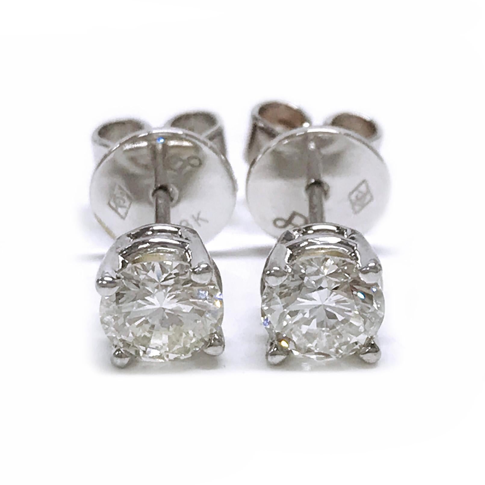 Beautiful timeless 18 Karat Brilliant-Cut Diamond Stud Earrings. The studs are four prong-set on a basket setting. The diamond studs measure 4.8mm each for an approximate total carat weight of 0.80ctw. The diamonds are SI2 (G.I.A.) in clarity and