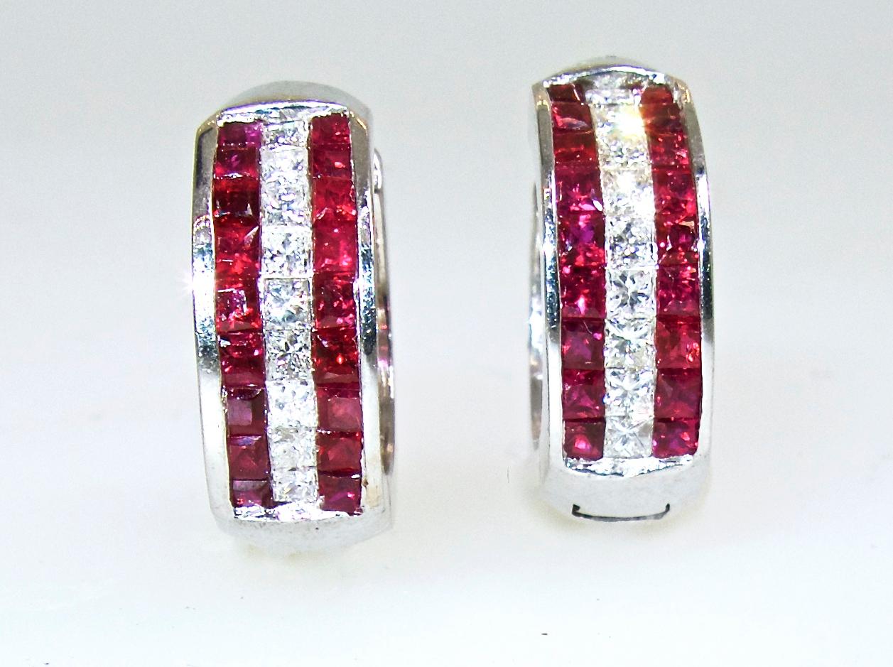 Fancy cut French cut diamonds, 18 in number, are all well cut and well matched and near colorless (G), and very slightly included (VS) in clarity.  There is approximately .90 cts.  The natural rubies are a bright vivid red. There are 36 stones