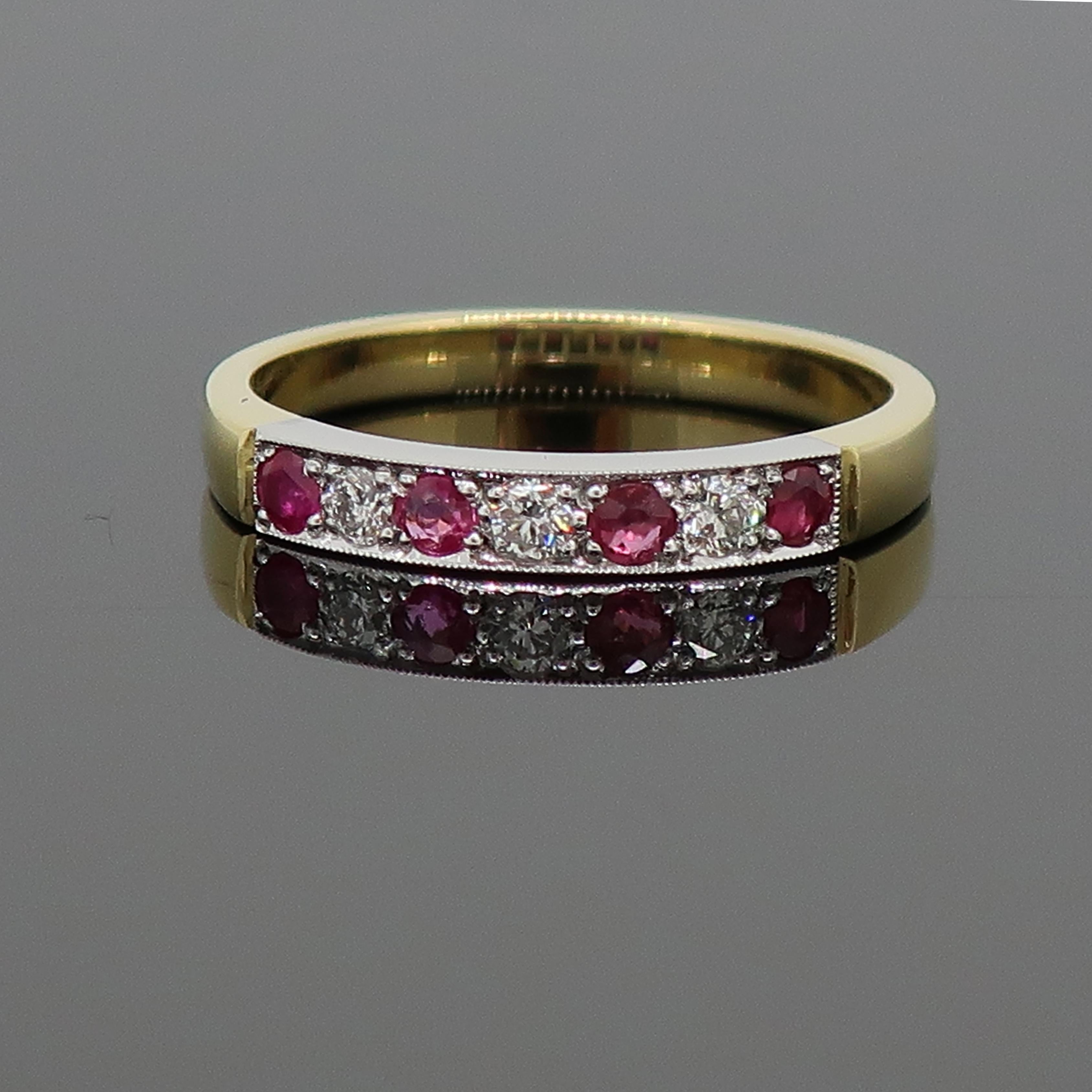 18 Karat Ruby And Diamond Eternity Band Ring Yellow And White Gold

A simple but classic seven stone ruby and diamond eternity ring. The ring consists of four round rubies and three round brilliant cut diamonds, all set in a mill-grain setting in