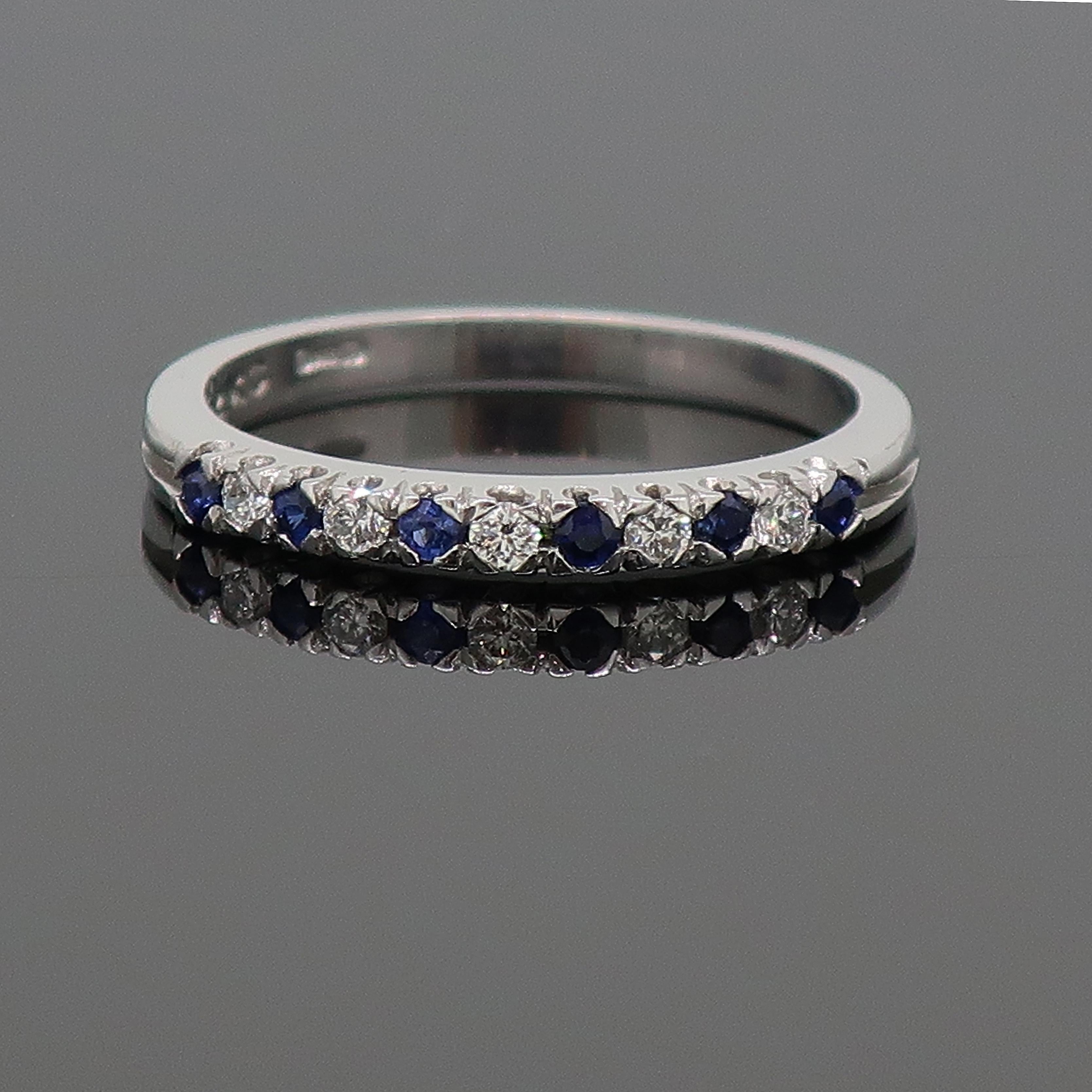 18 Karat Sapphire And Diamond Eternity Band Ring White Gold

A delicate and dainty eleven stone sapphire and diamond eternity ring. The ring consists of six round sapphires and five round brilliant cut diamonds in a corner claw coronet style
